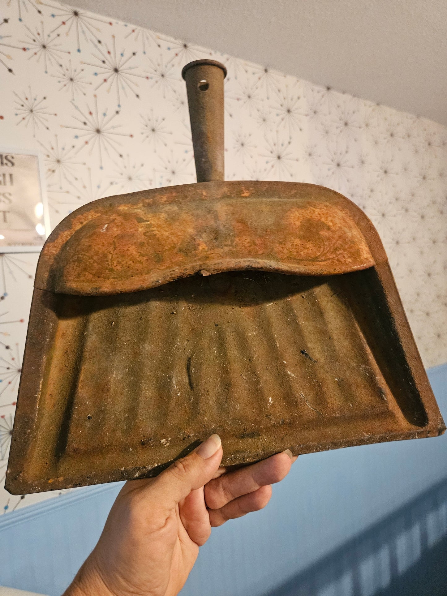 Antique JV Reed tin dustpan with heavy rustic amber and brown patina on corrugated tin body