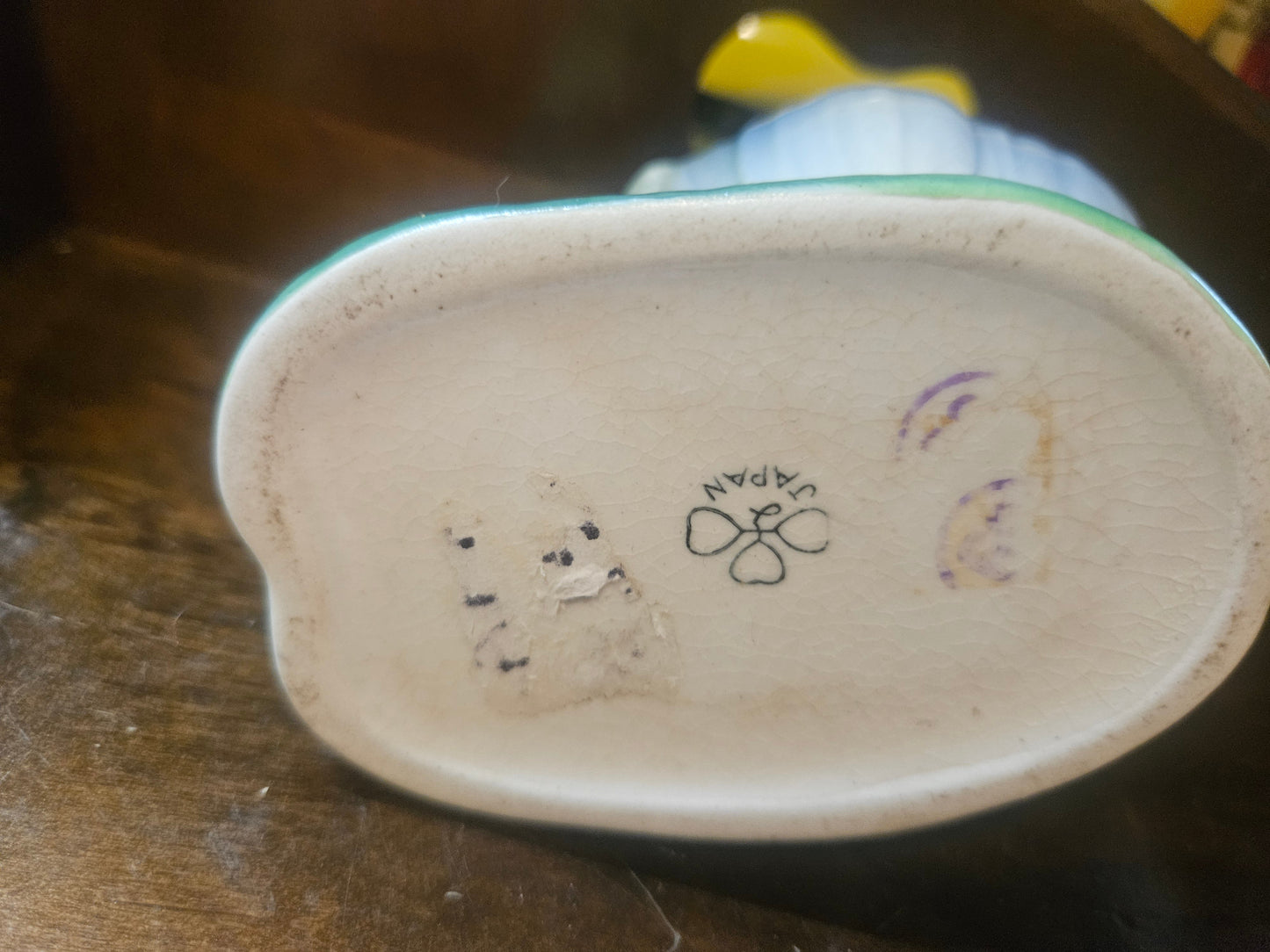 Bottom view showing Japan stamp with clover mark