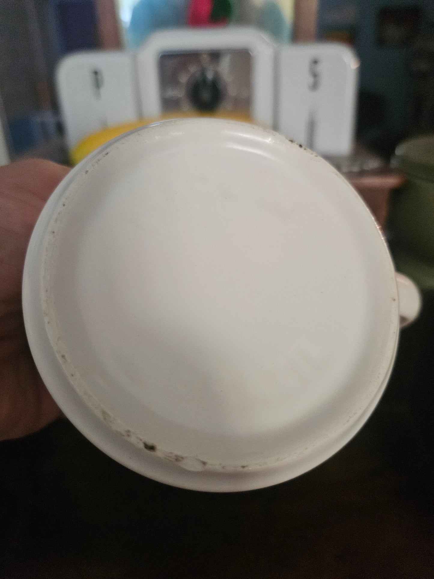 Bottom of lefties do it right mug showing unglazed foot ring and no maker's mark