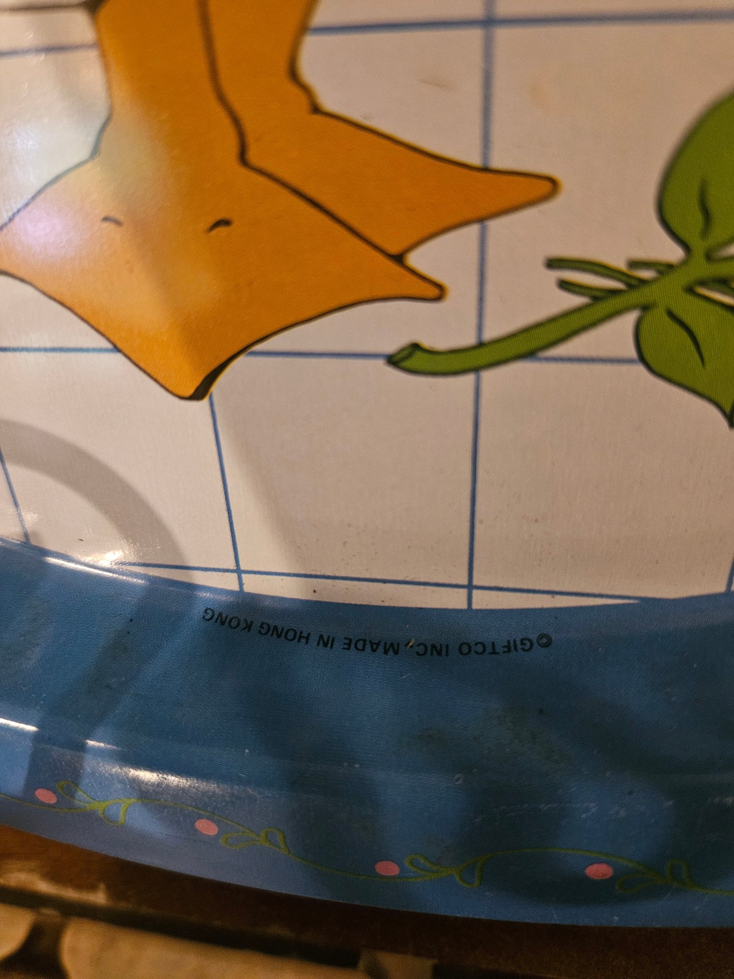 Close-up of Giftco Inc. Made in Hong Kong stamp on bottom rim of tin tray