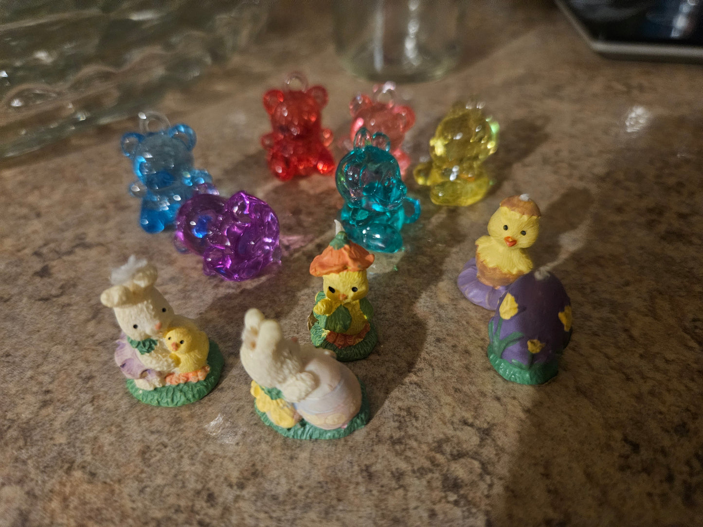 Easter figurines spread out showing gummy bear figures and resin bunny and chick figurines