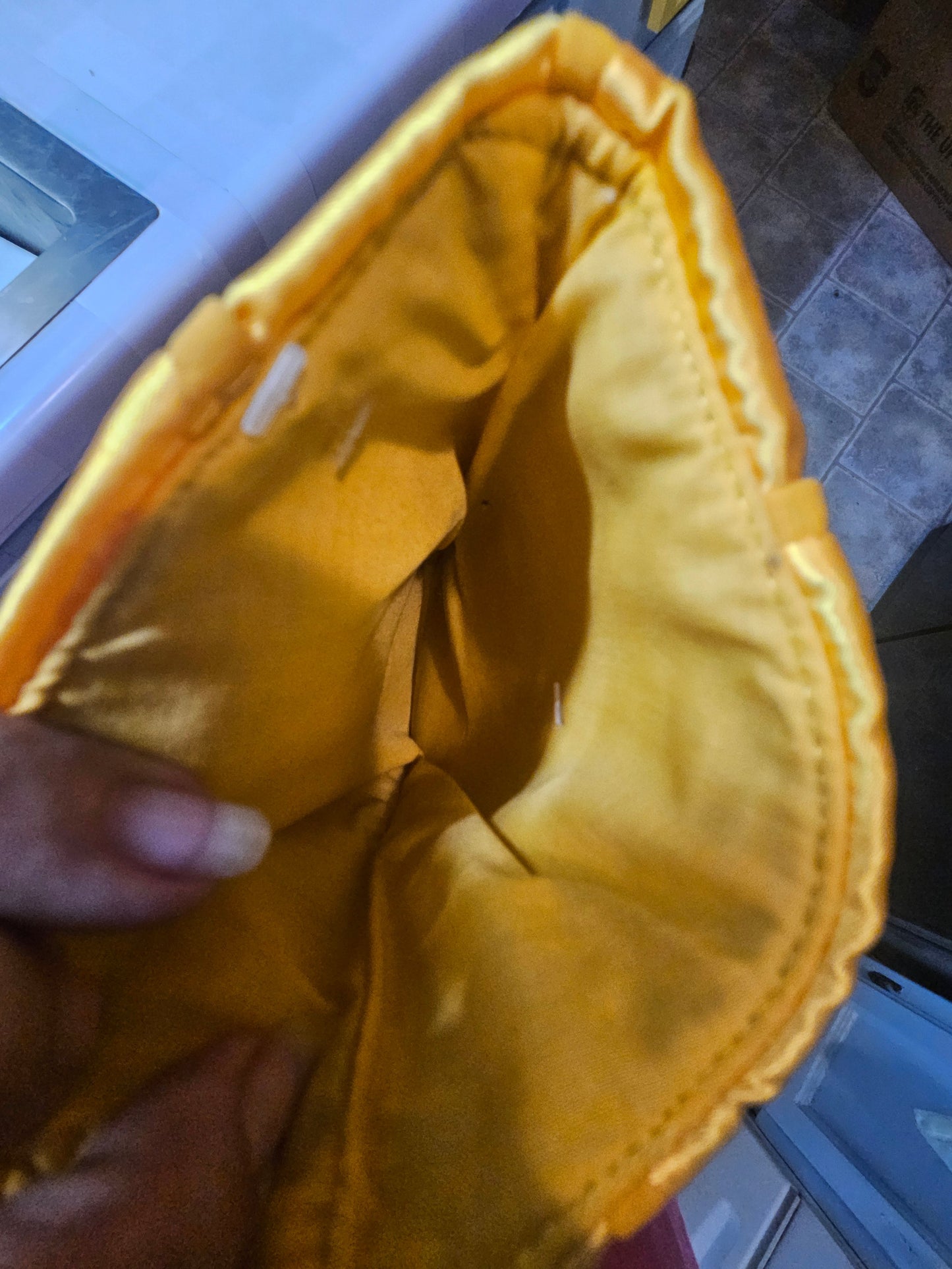 Interior of A Christmas Story Leg Lamp stocking shade showing yellow satin lining and opening for gifts