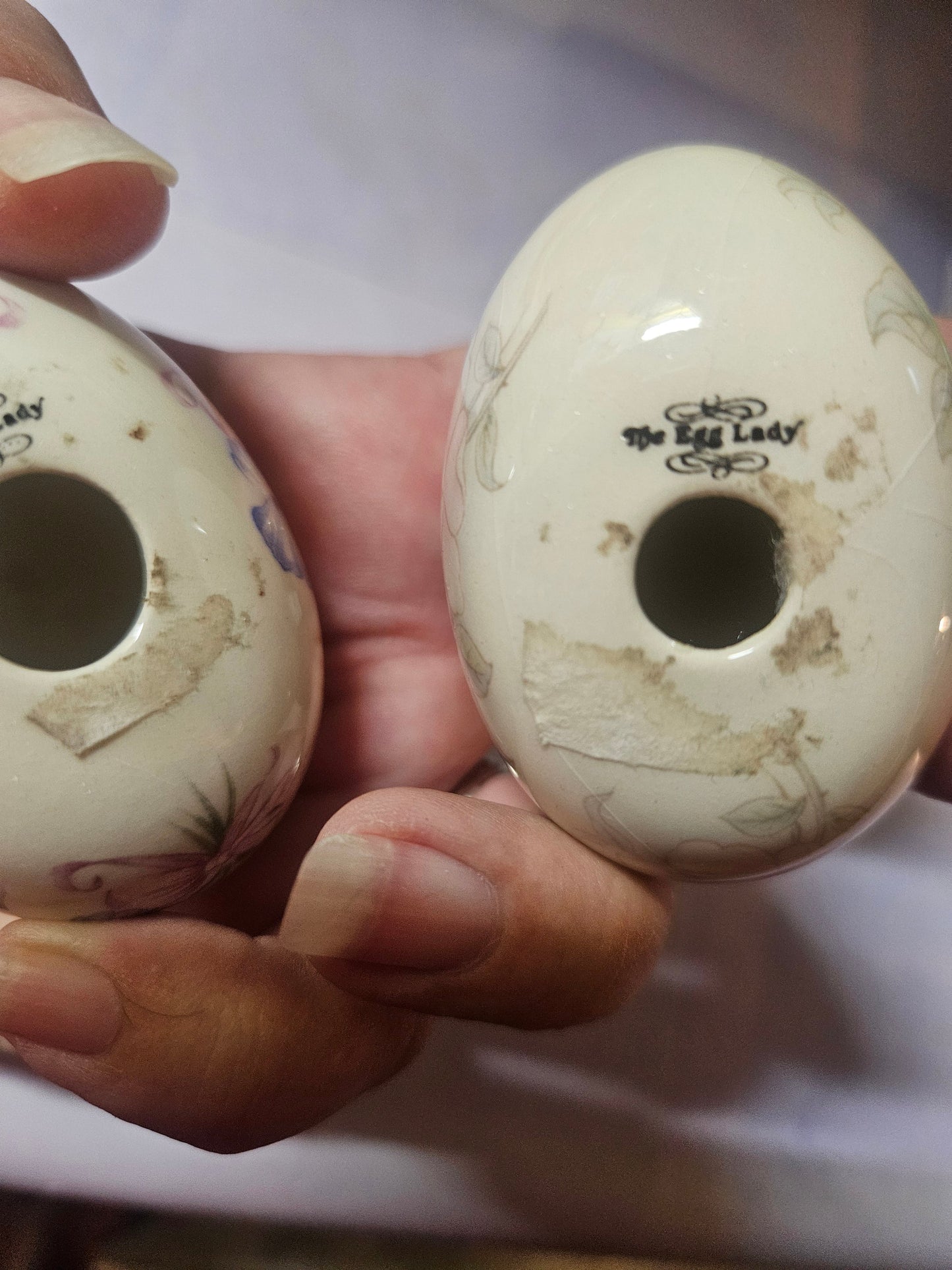 Bottom view of both eggs showing The Egg Lady signature mark and base holes