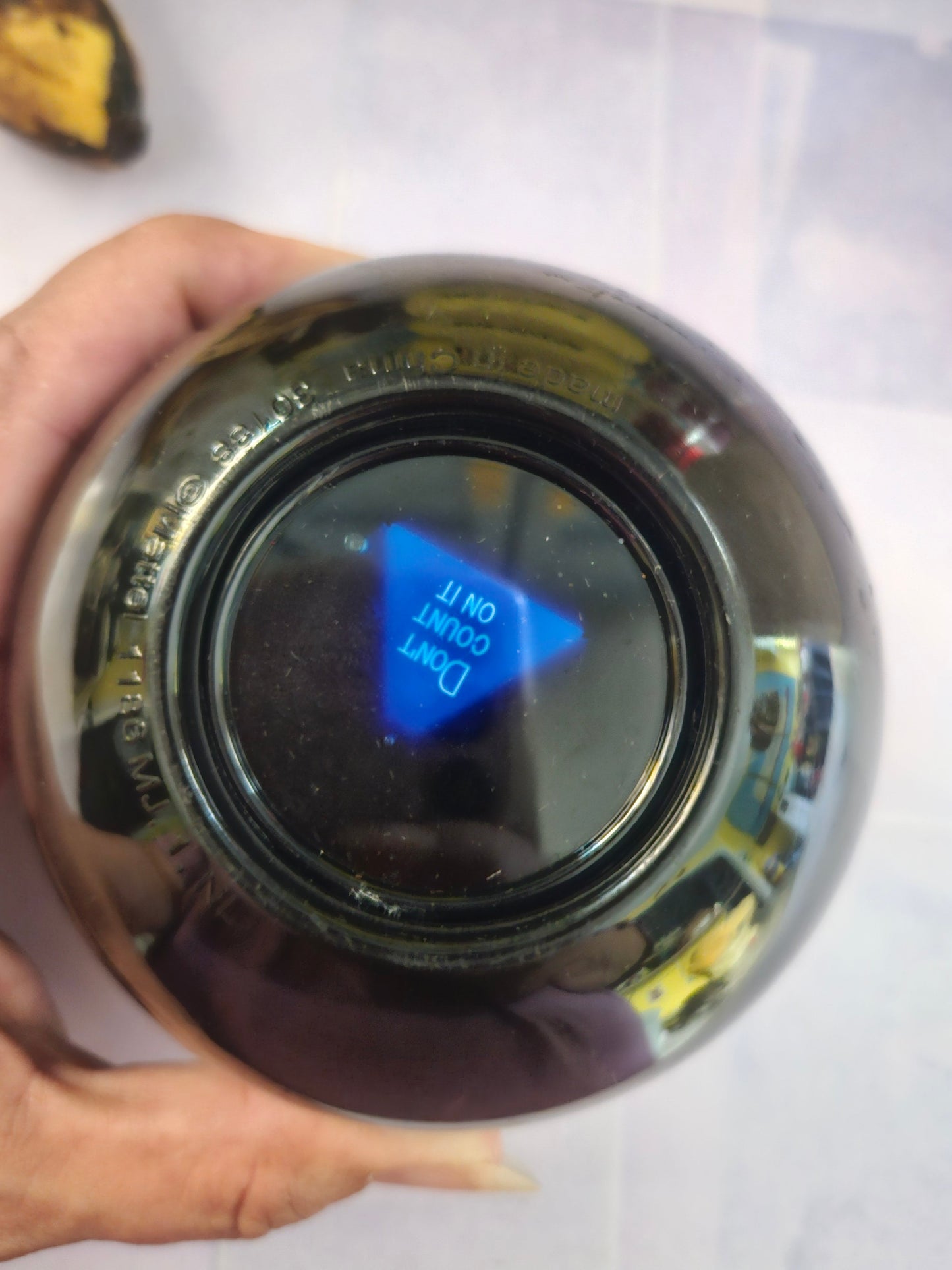Vintage Magic 8 Ball bottom showing answer window with blue die reading Don't Count On It