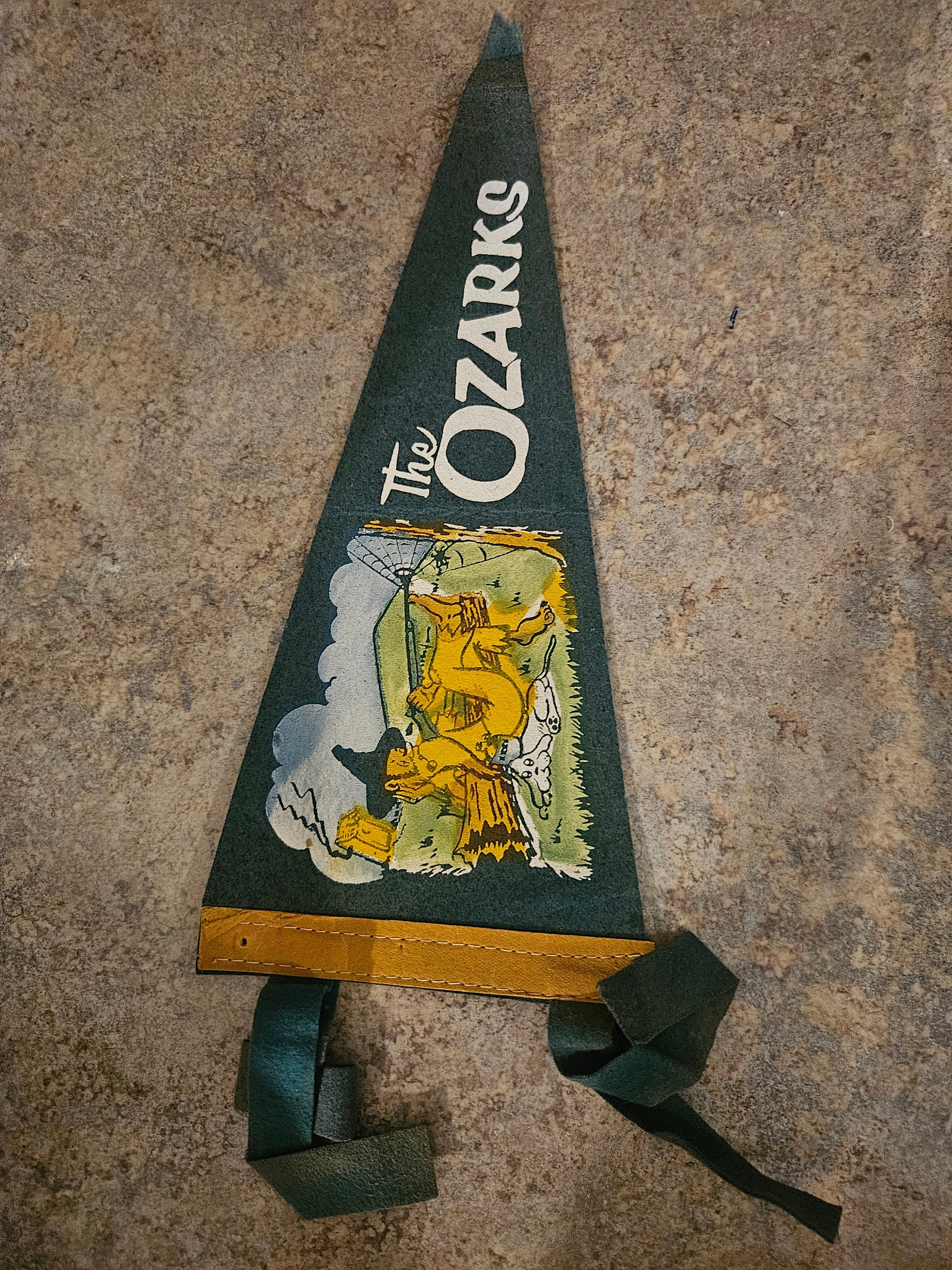 Vintage The Ozarks souvenir felt pennant front showing green felt white lettering and hillbilly caricature graphic