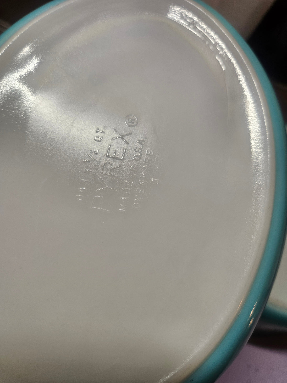 Close-up of the clear Pyrex lid edge marked 943 C 11