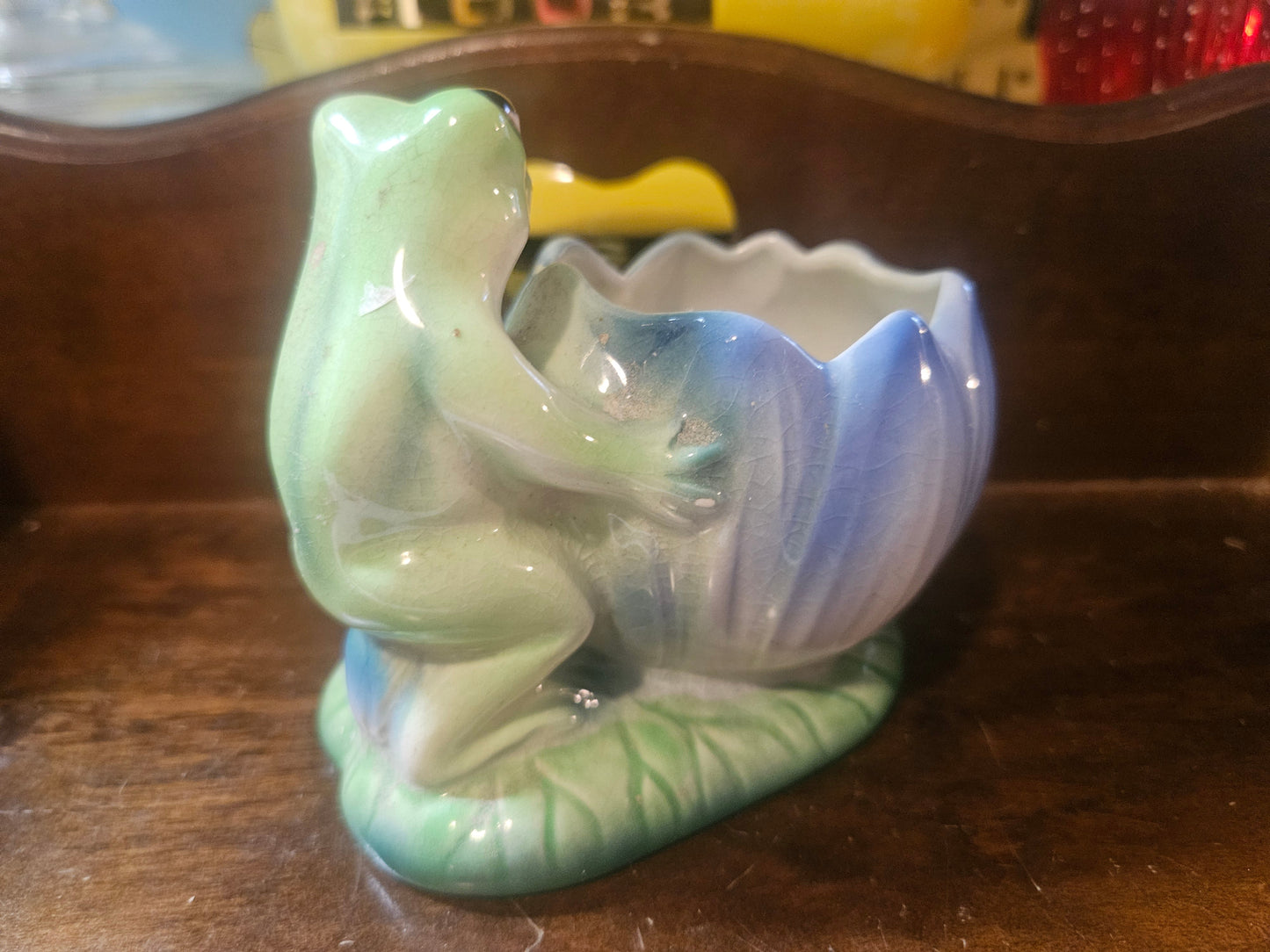 Side view showing frog figure and lotus planter bowl detail