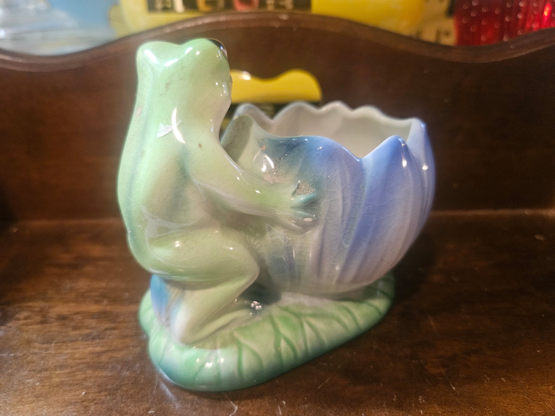 Side view showing frog figure and lotus planter bowl detail