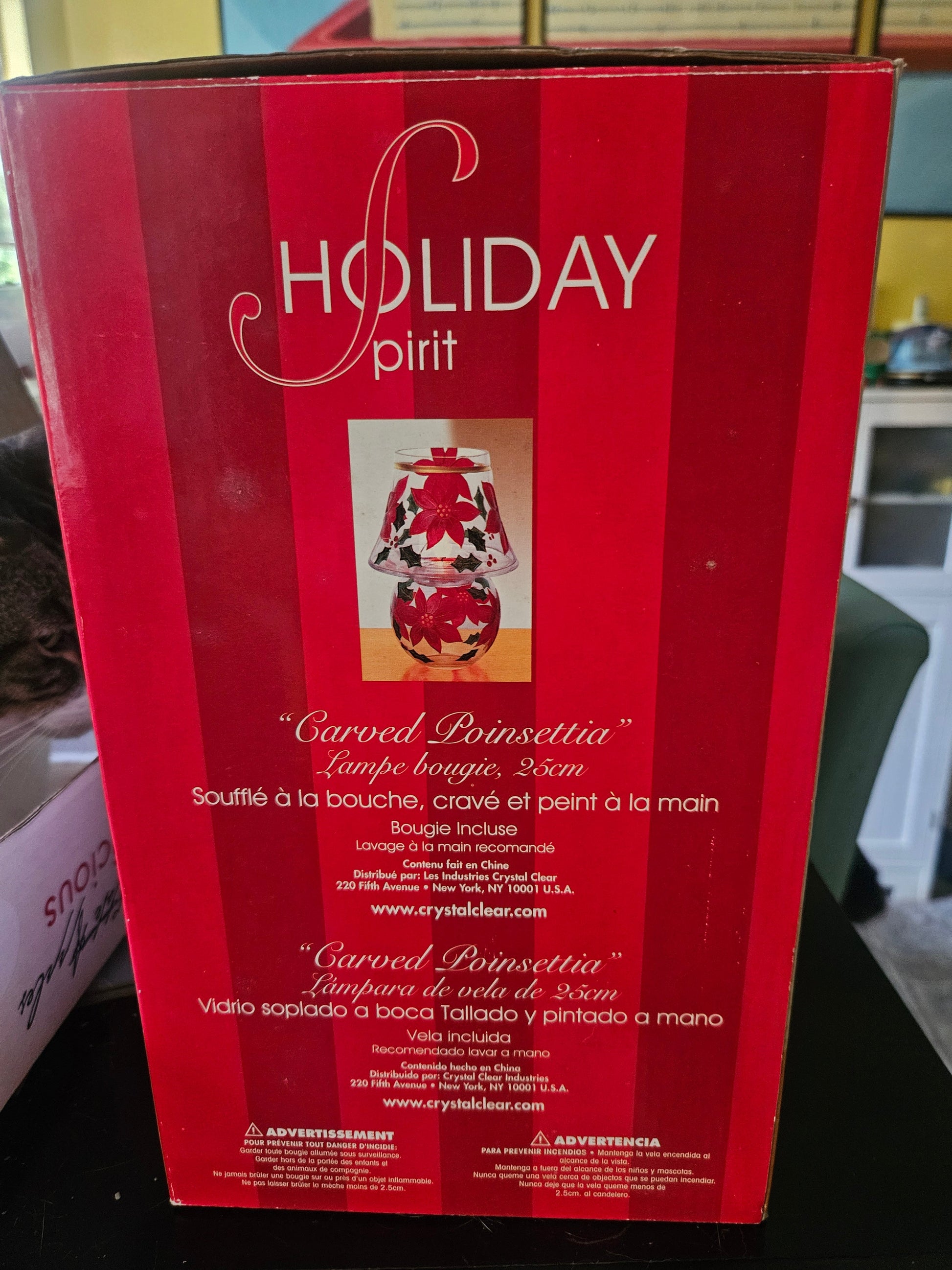 Front of Holiday Spirit box showing Carved Poinsettia candle lamp with red poinsettias and holly leaves