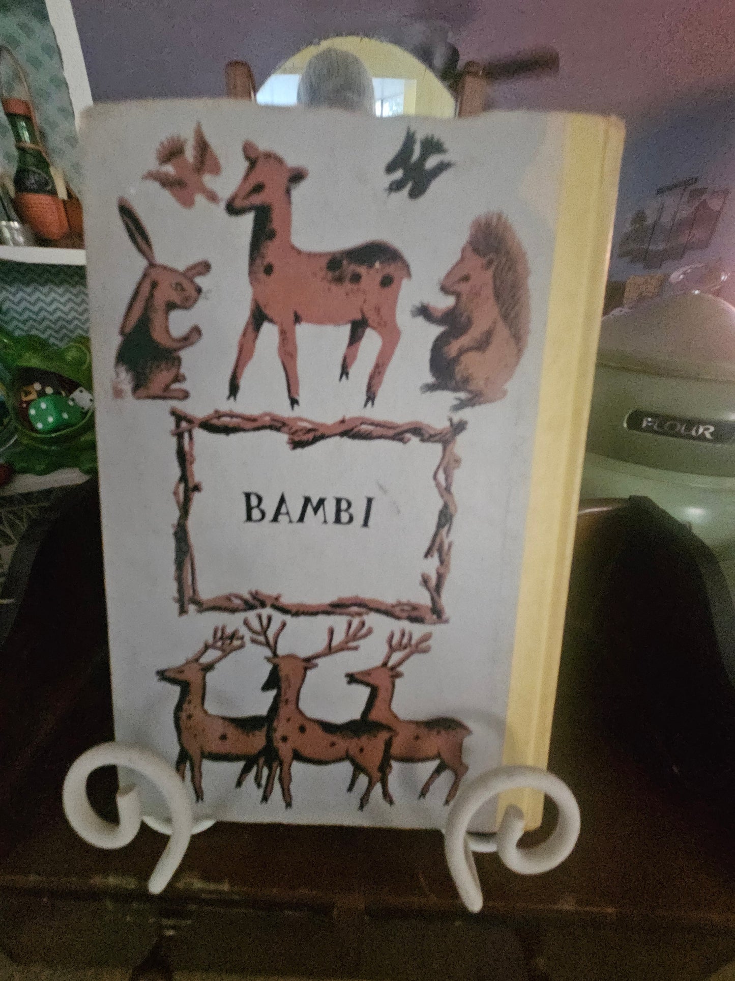 Vintage Bambi hardcover book back cover showing deer folk art illustration and yellow spine