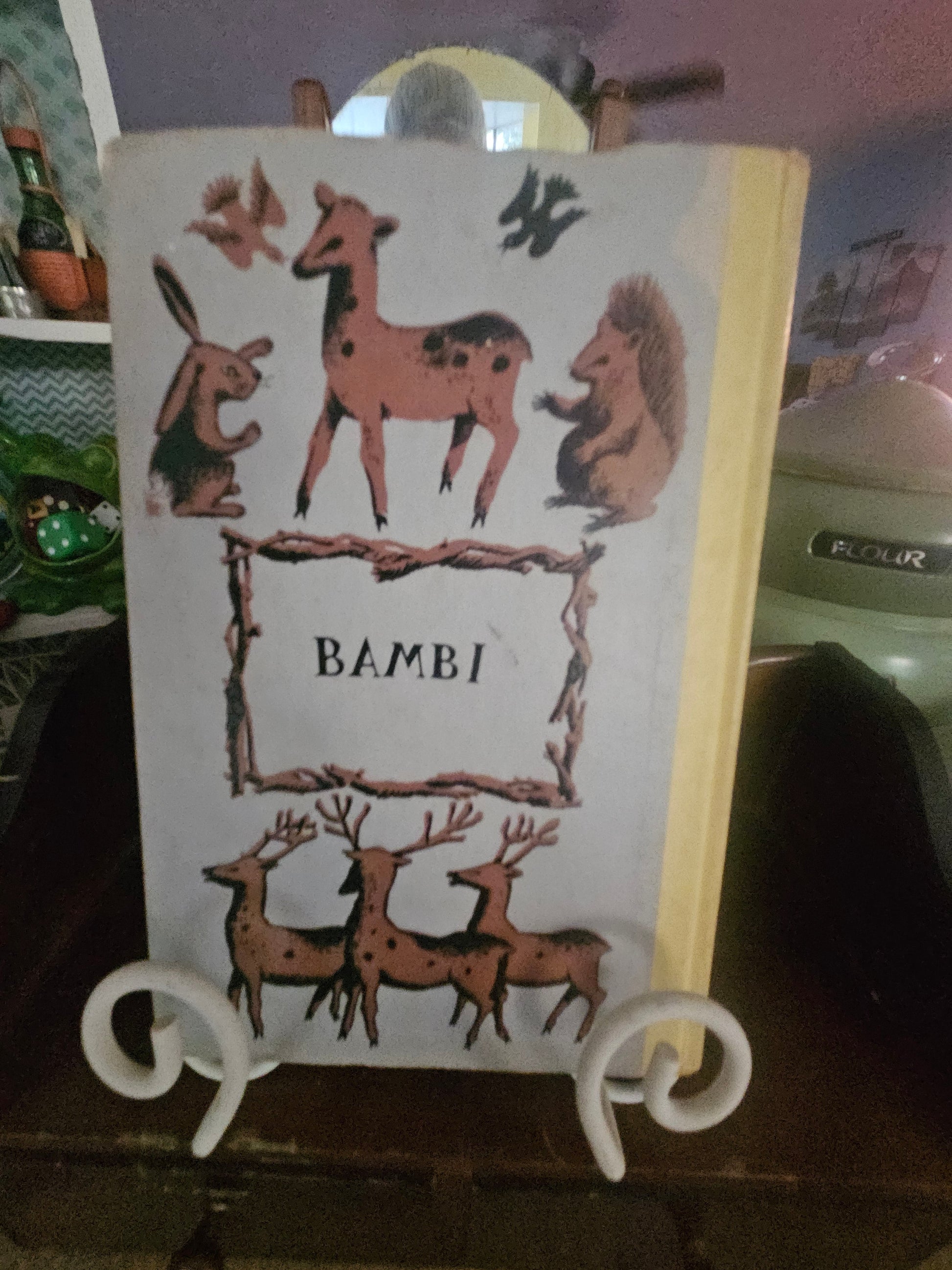 Vintage Bambi hardcover book back cover showing deer folk art illustration and yellow spine