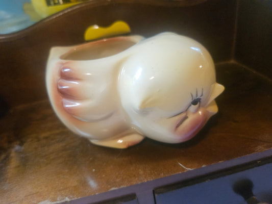 Vintage ceramic baby duck planter side view showing mauve-brown wings and open top bowl