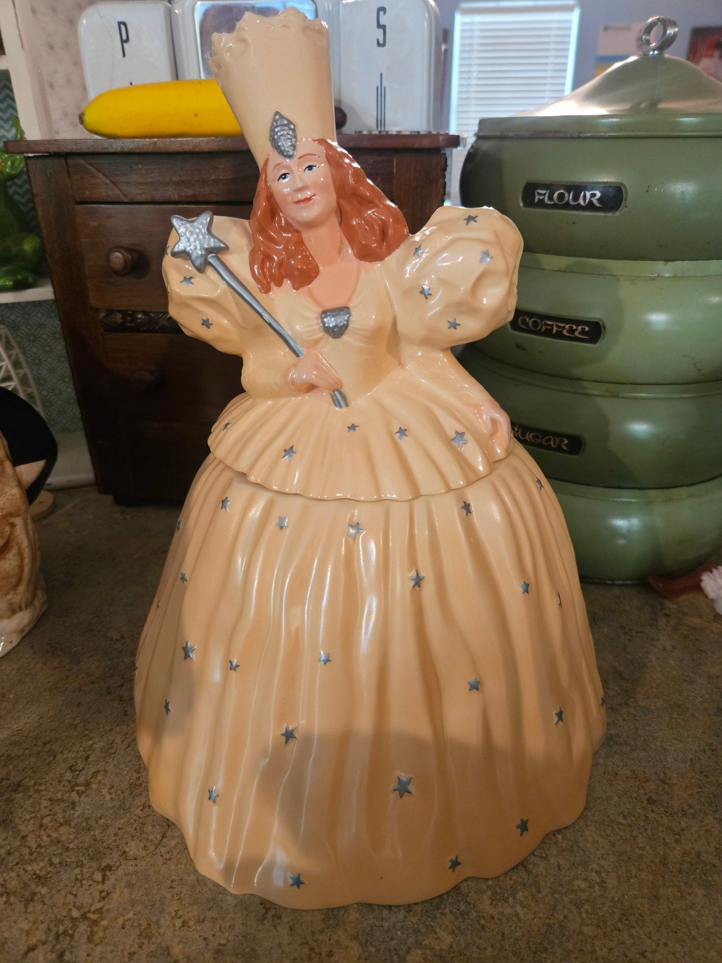 Wizard of Oz Glinda the Good Witch large ceramic cookie jar front view showing peach gown silver stars and star wand