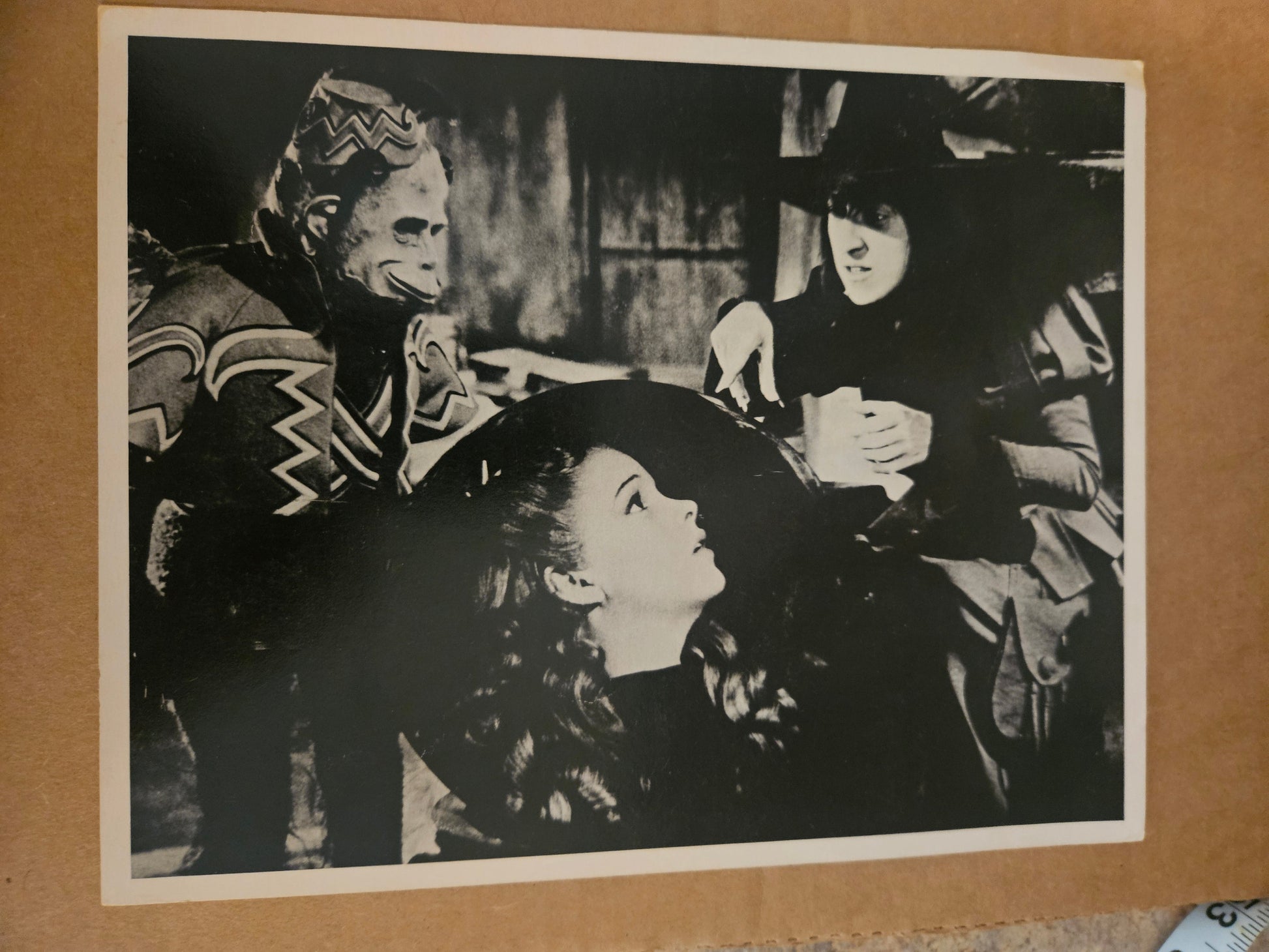 Vintage black and white photo print of Dorothy and Scarecrow inside the Wicked Witch castle with Winged Monkey guards in background