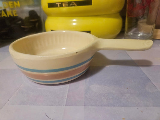 Vintage ceramic handled bowl with blue and pink stripes, side view