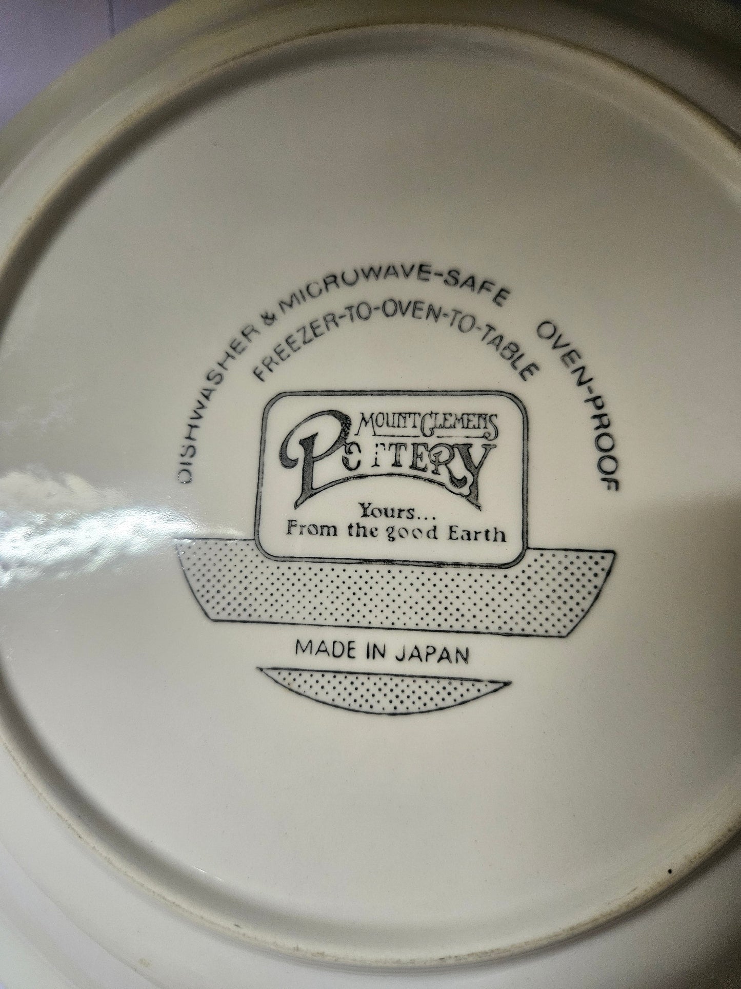 Bottom showing Mount Clemens Pottery mark, Made in Japan stamp, and care instructions