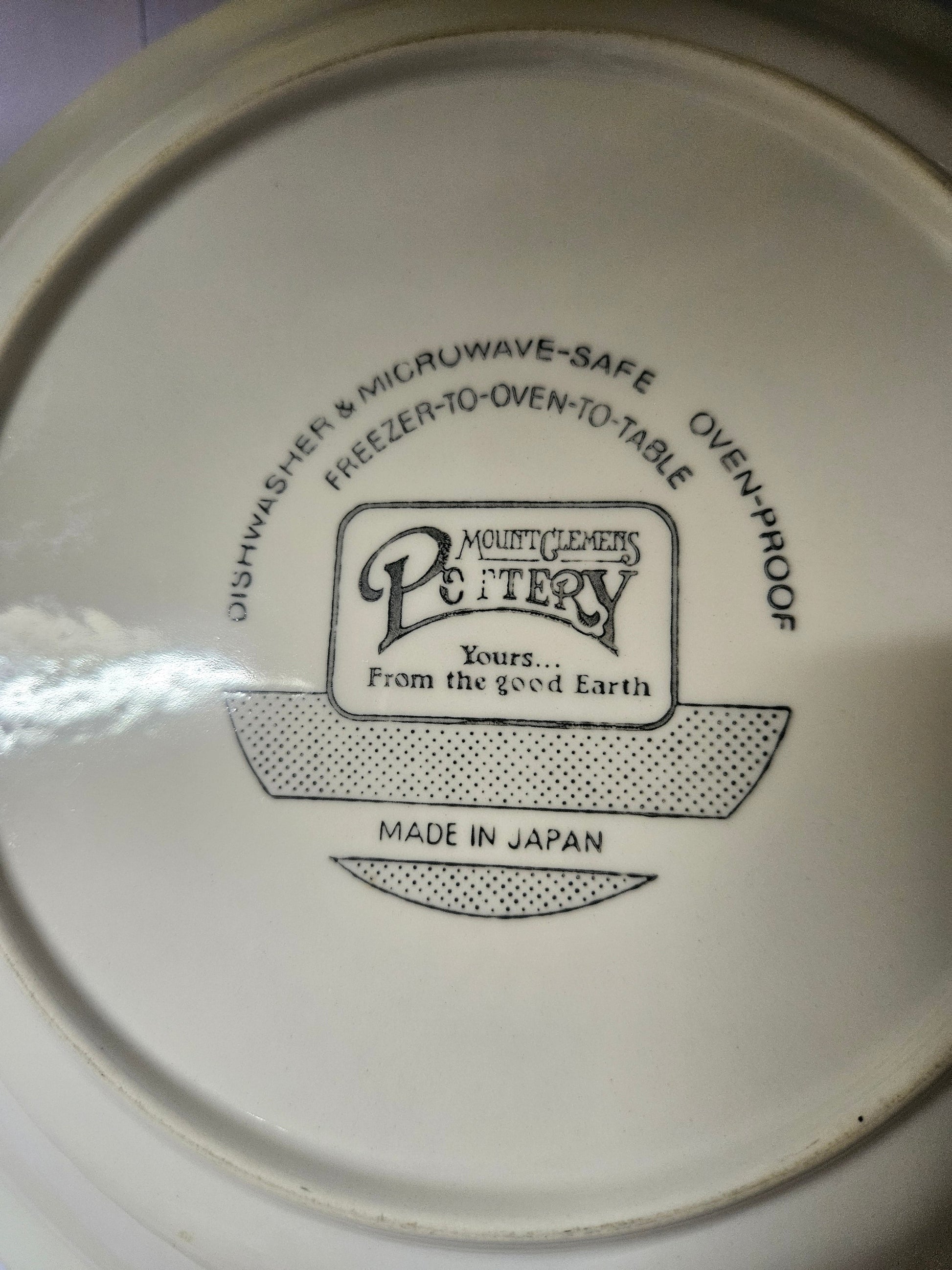 Bottom showing Mount Clemens Pottery mark, Made in Japan stamp, and care instructions
