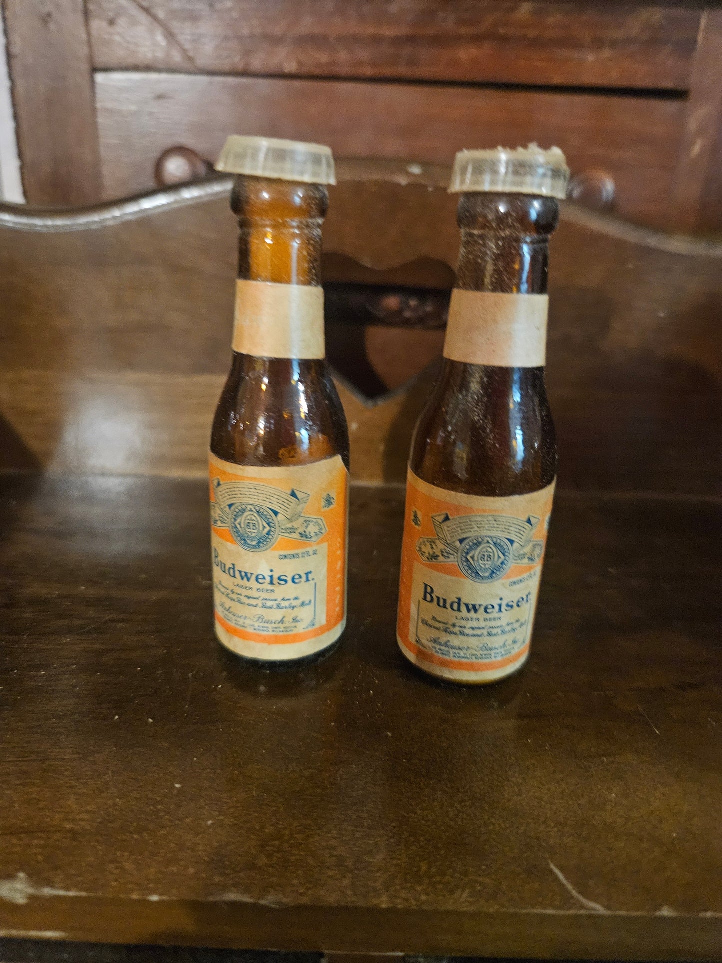 Vintage Budweiser miniature bottle salt and pepper shakers front view showing amber glass bottles with original labels and plastic caps