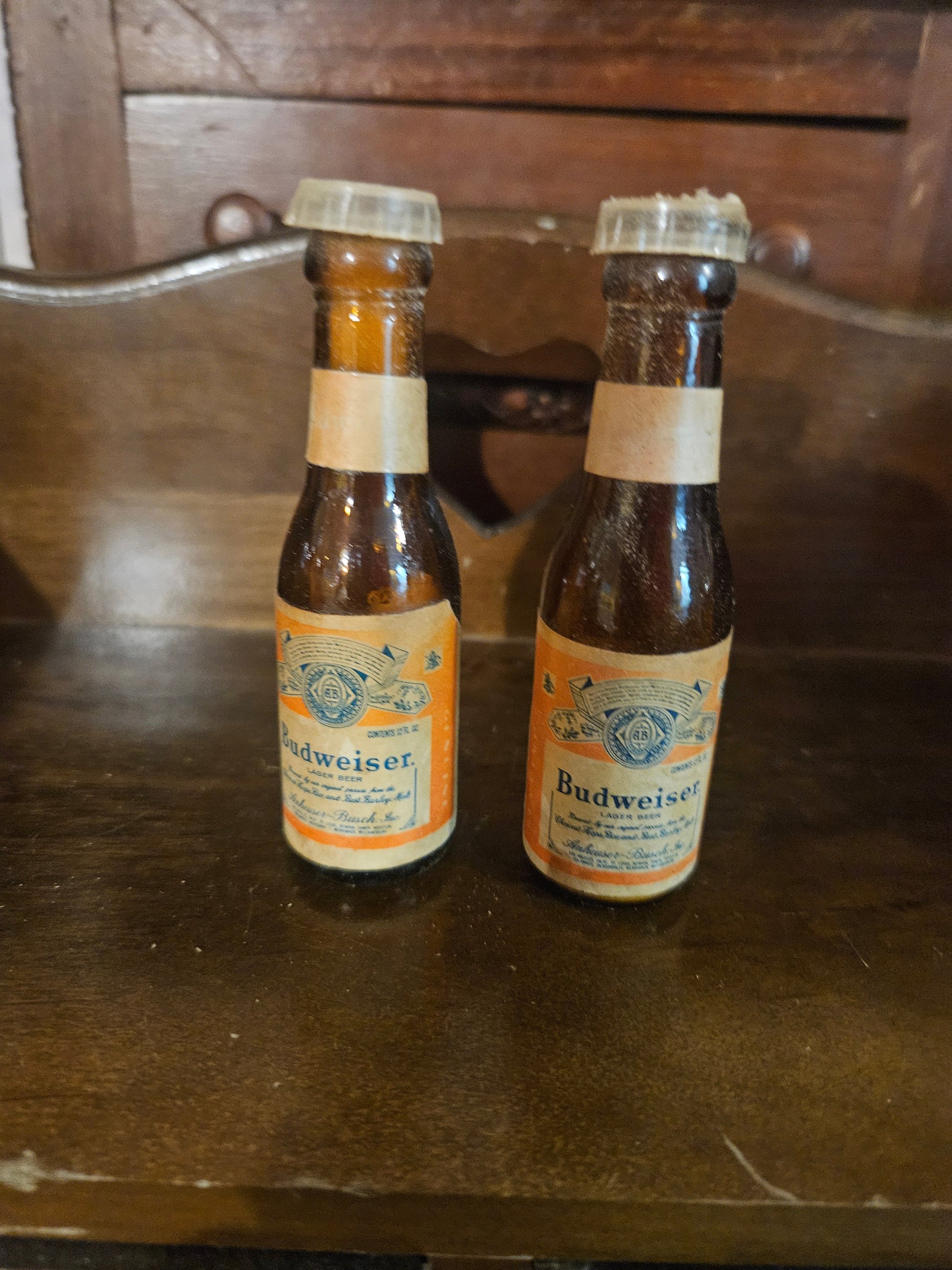 Vintage Budweiser miniature bottle salt and pepper shakers front view showing amber glass bottles with original labels and plastic caps