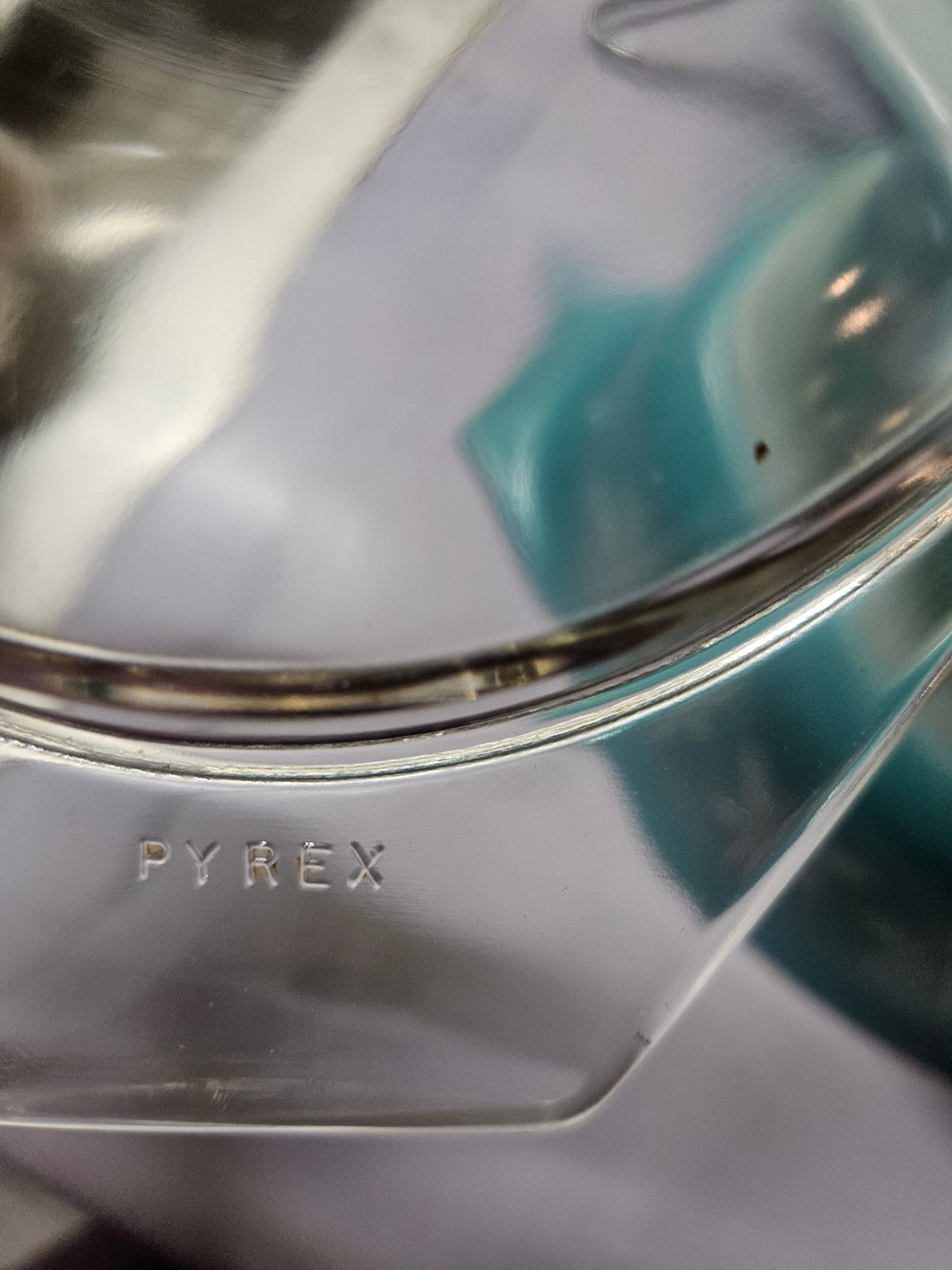 Bottom stamp of the smaller Pyrex casserole, reading PYREX 1½ QT., Made in U.S.A., Ovenware