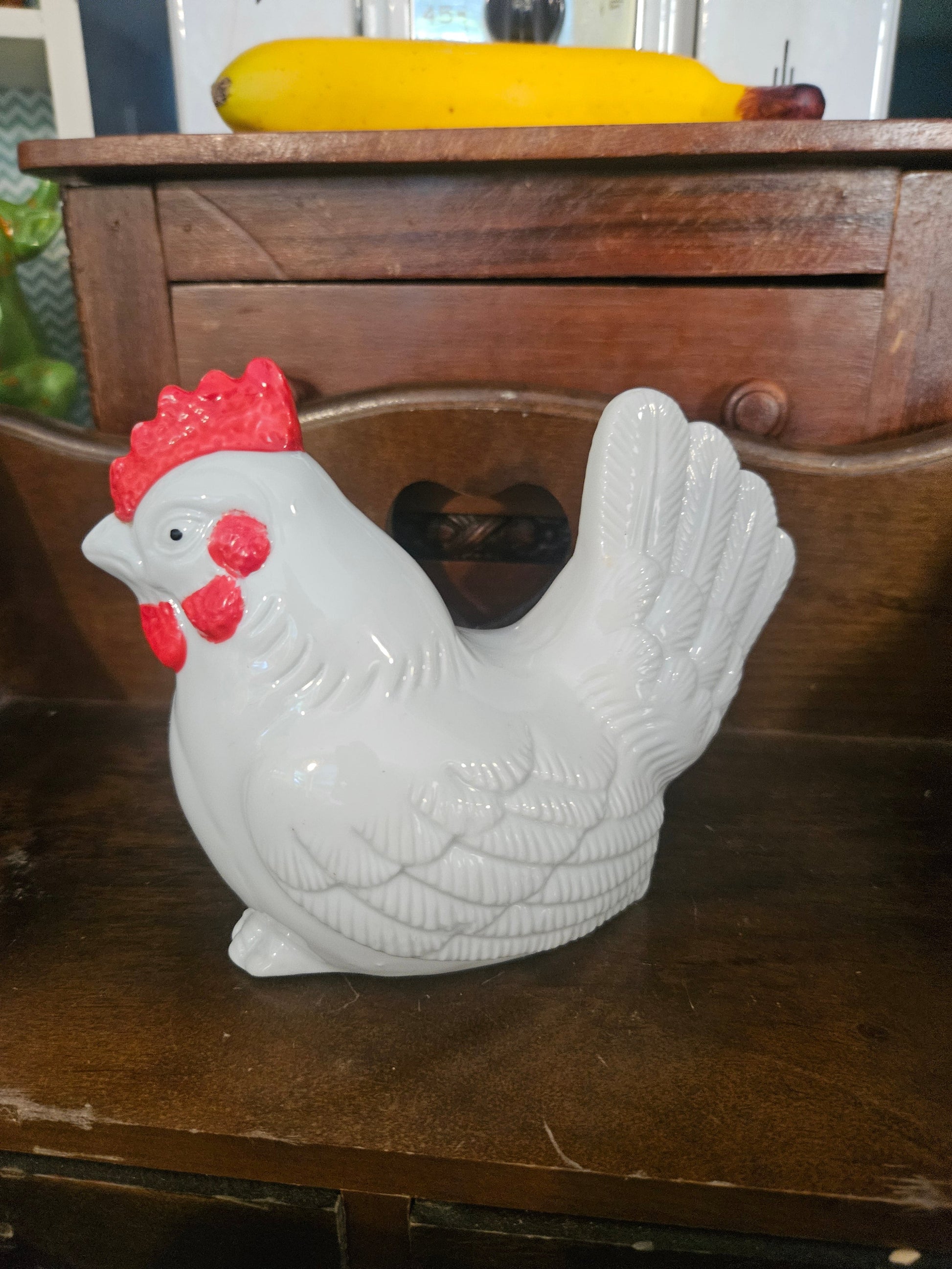 Vintage ceramic rooster figurine left side view showing white gloss glaze and red comb