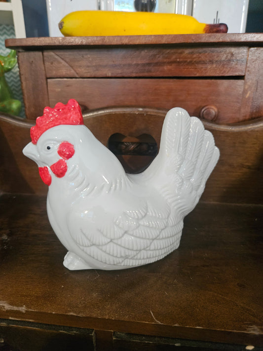 Vintage ceramic rooster figurine left side view showing white gloss glaze and red comb