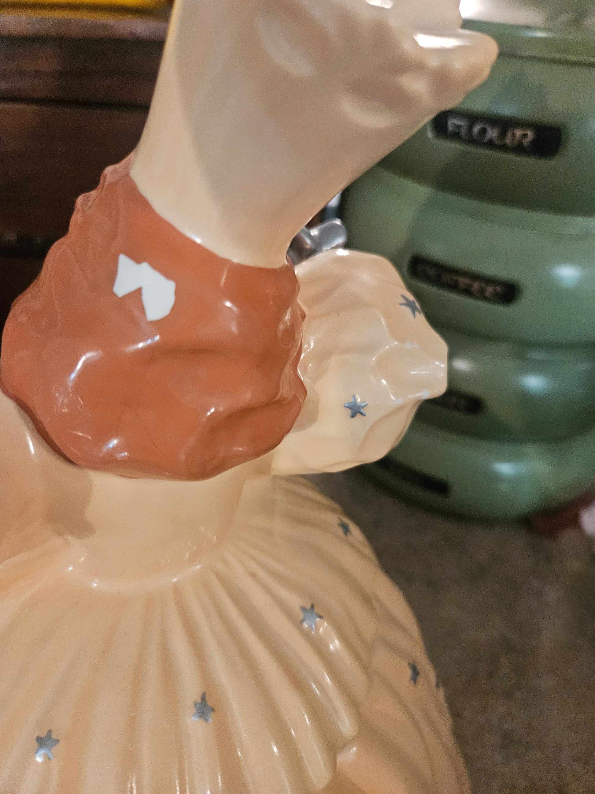 Close-up of small chip on back of head of Glinda cookie jar not visible from front