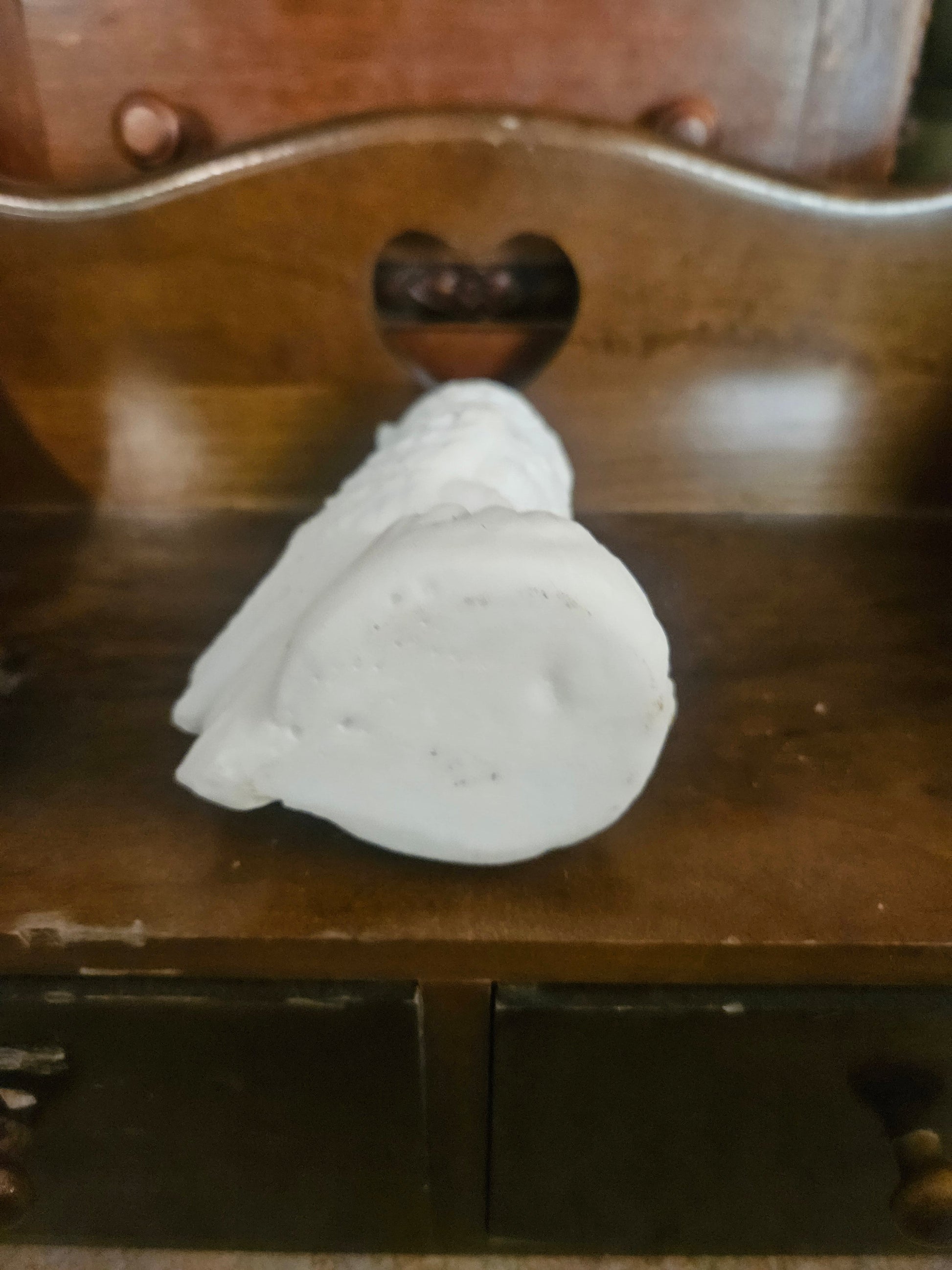 Bottom view of vintage white chalkware owl figurine showing base and flat bottom