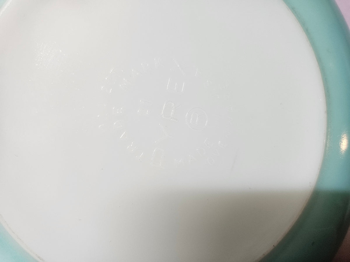Faint maker's mark on the bottom of the turquoise bowl, too faded to read