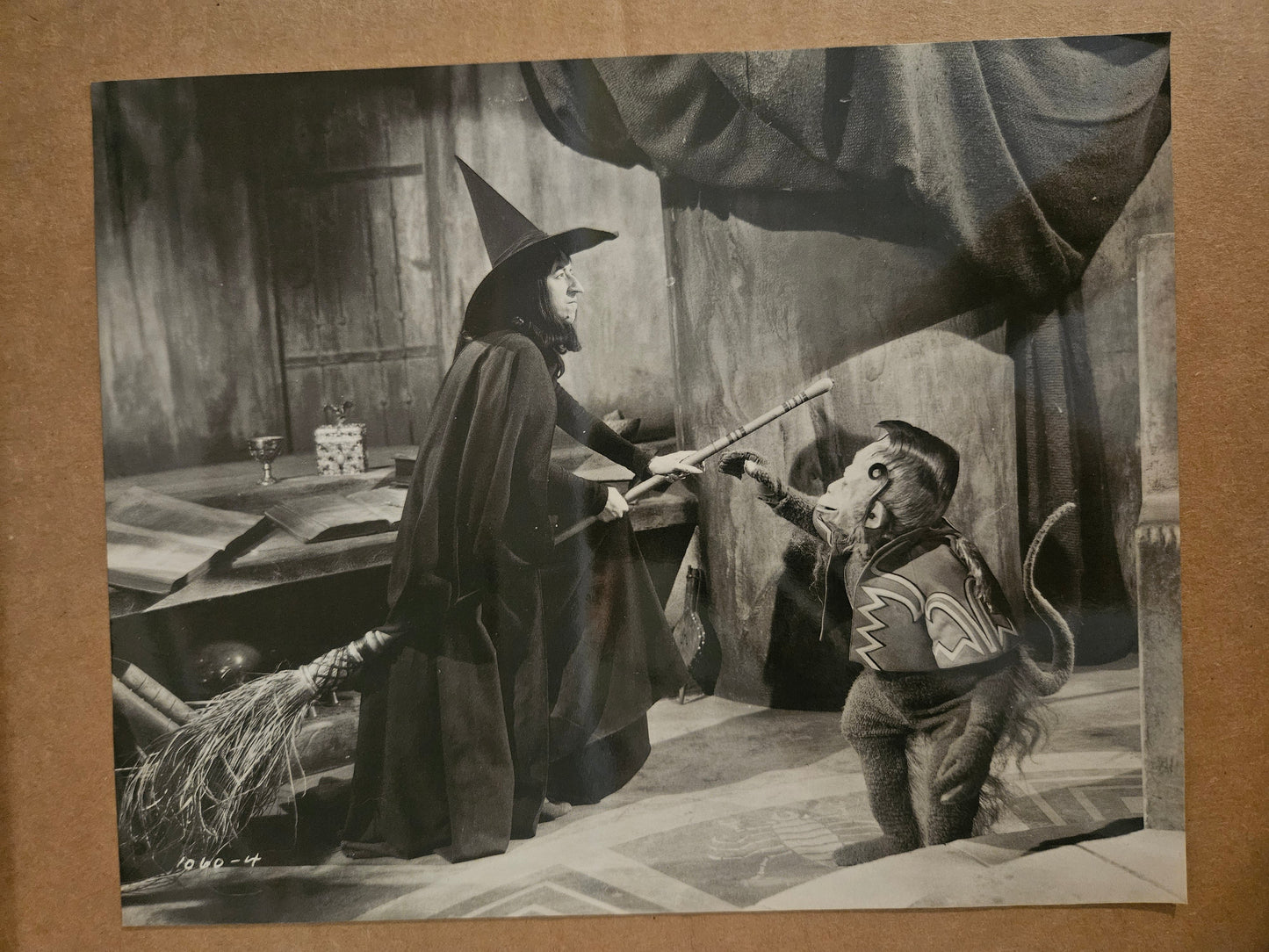 Wizard of Oz large black and white postcard showing Wicked Witch of the West with Winged Monkey in castle scene