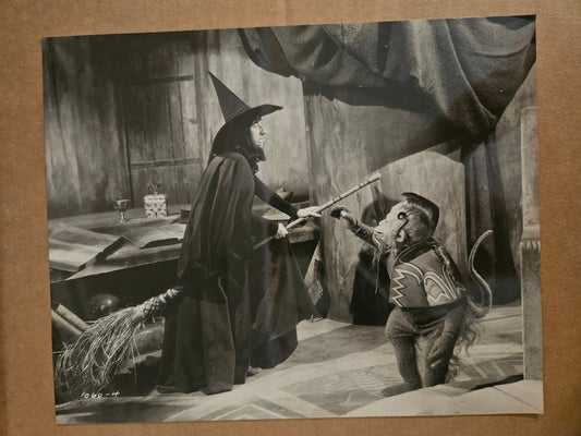 Wizard of Oz large black and white postcard showing Wicked Witch of the West with Winged Monkey in castle scene