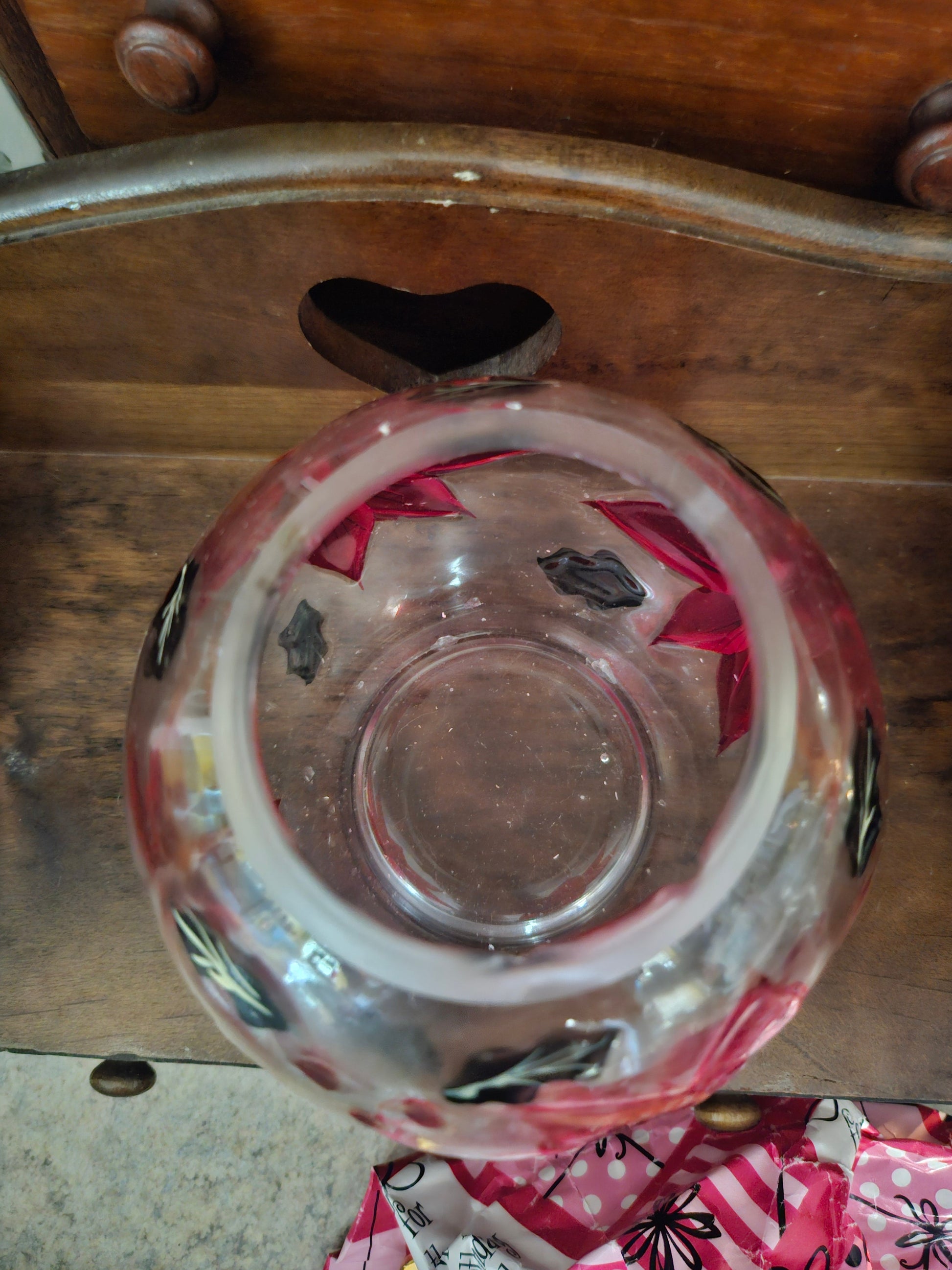 Close-up of globe base bottom showing flea bite chips and glass construction detail
