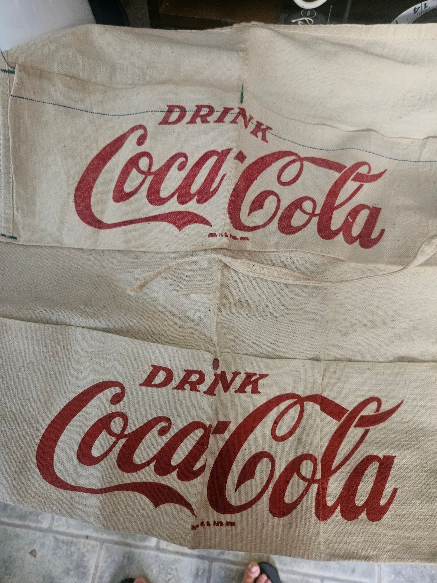 Two vintage Drink Coca-Cola canvas banners showing red script logo on cream canvas