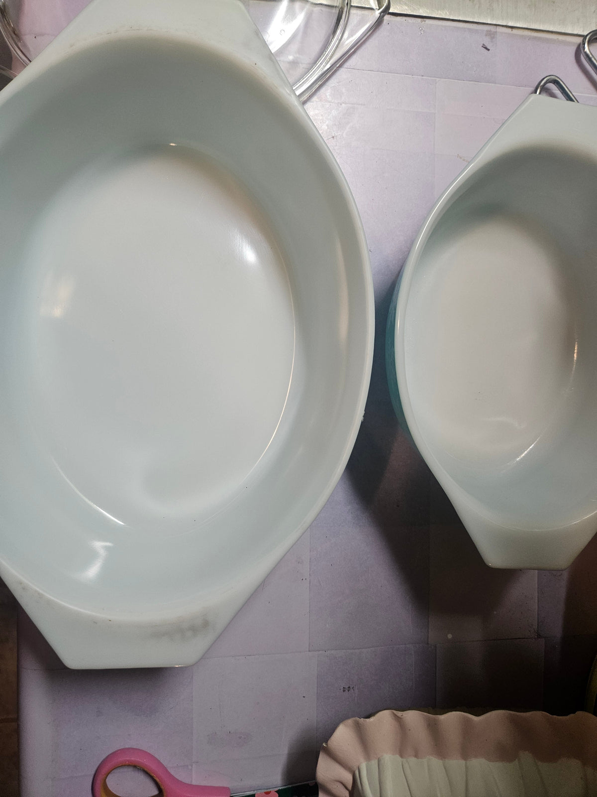 Faint bottom stamp on the larger turquoise Pyrex casserole