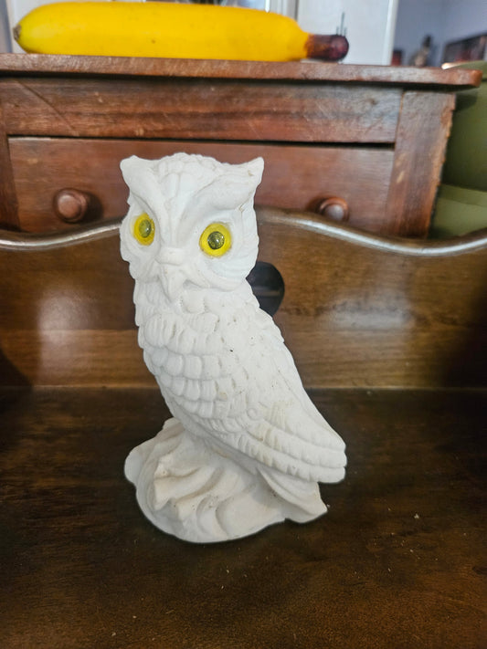 Vintage white chalkware owl figurine with yellow glass eyes front view