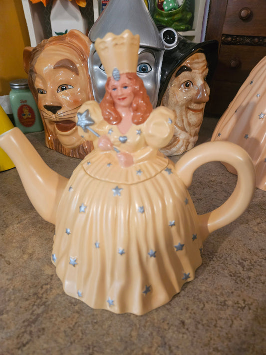 Wizard of Oz Glinda the Good Witch ceramic teapot by Warner Bros Studio Store 1998 showing yellow star gown and removable lid