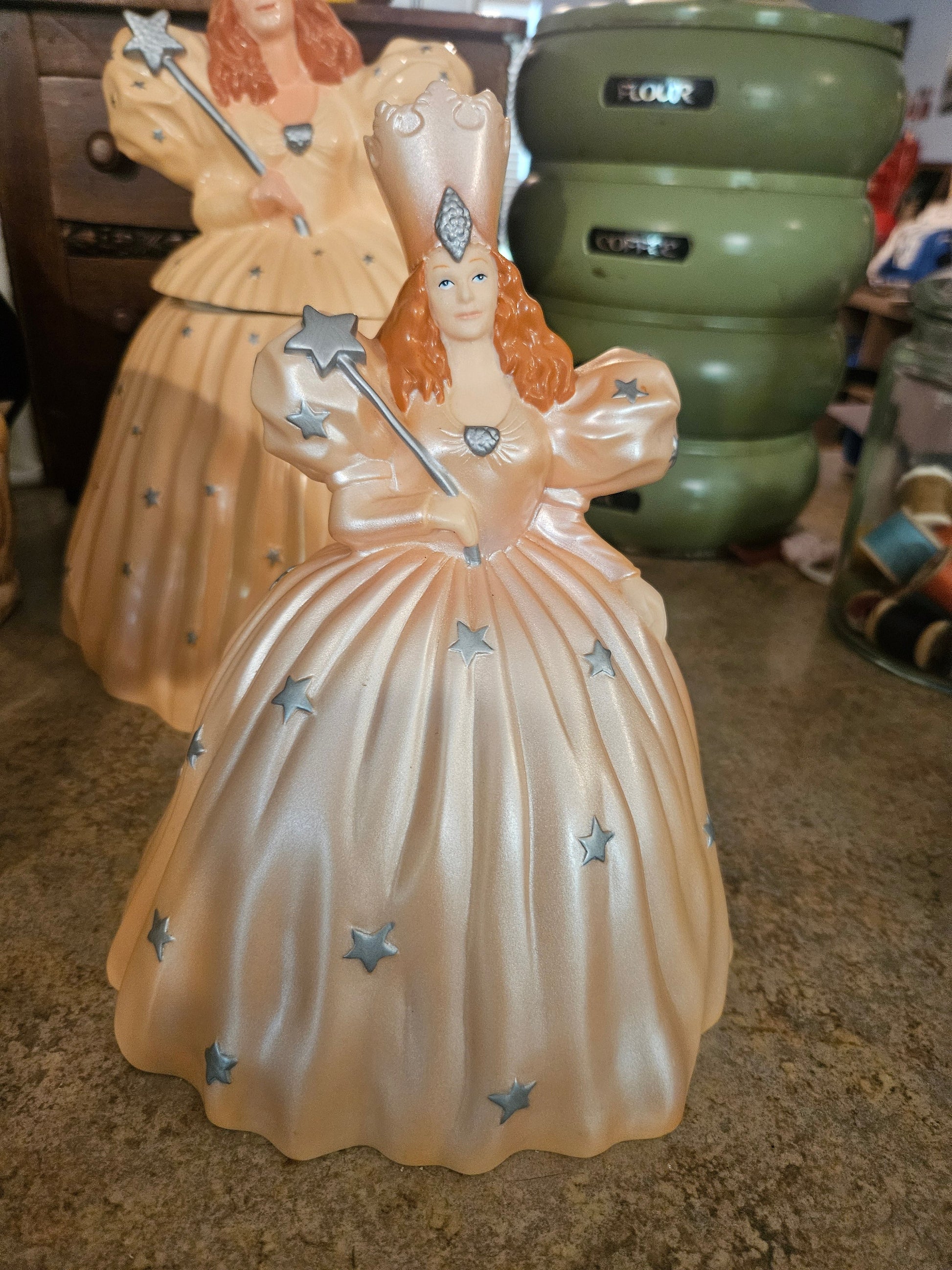 Wizard of Oz Glinda the Good Witch coin bank by Warner Bros Studio Store 1998 showing pearlescent blush gown with silver stars and star wand