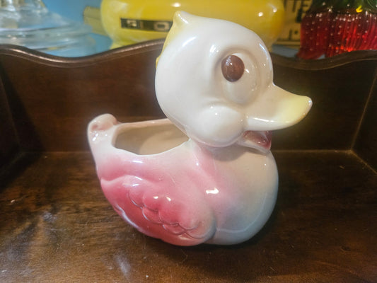 Vintage ceramic duck planter, side view showing pink wings and white head