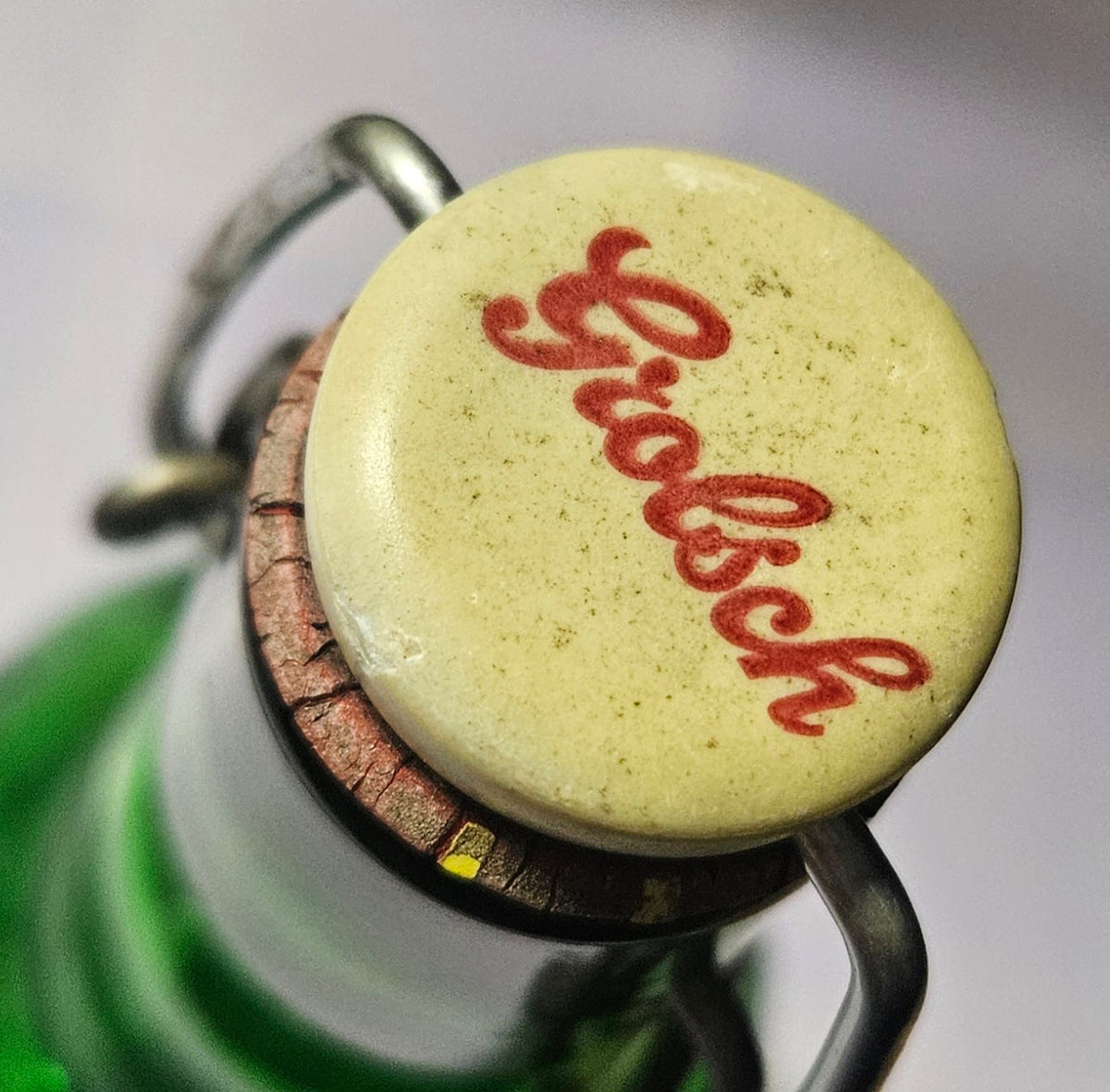 Full view of vintage green Grolsch glass bottle with swing-top cap