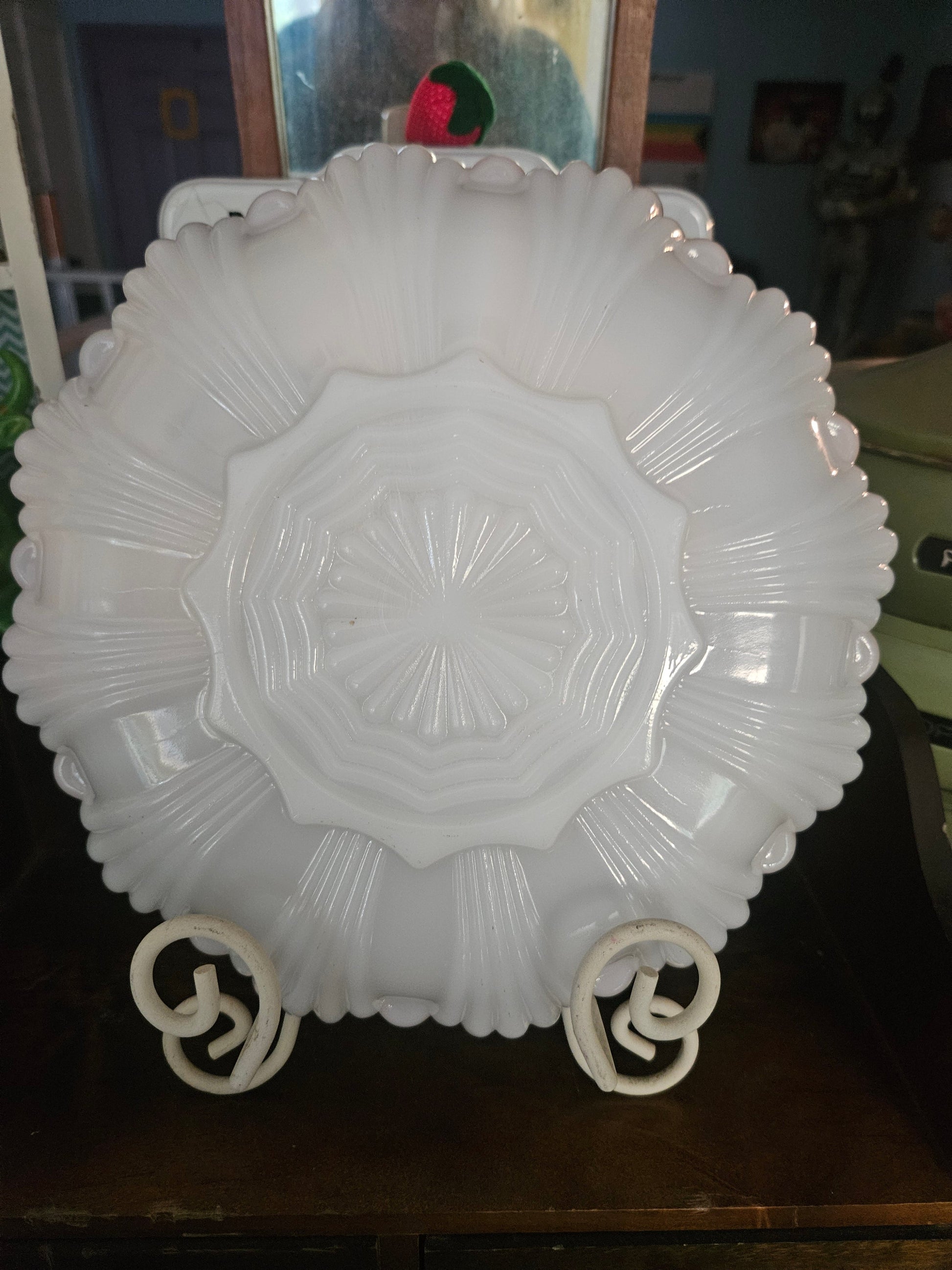 Back of Anchor Hocking milk glass relish tray showing pressed starburst fan medallion pattern with radiating ribs and scalloped rim