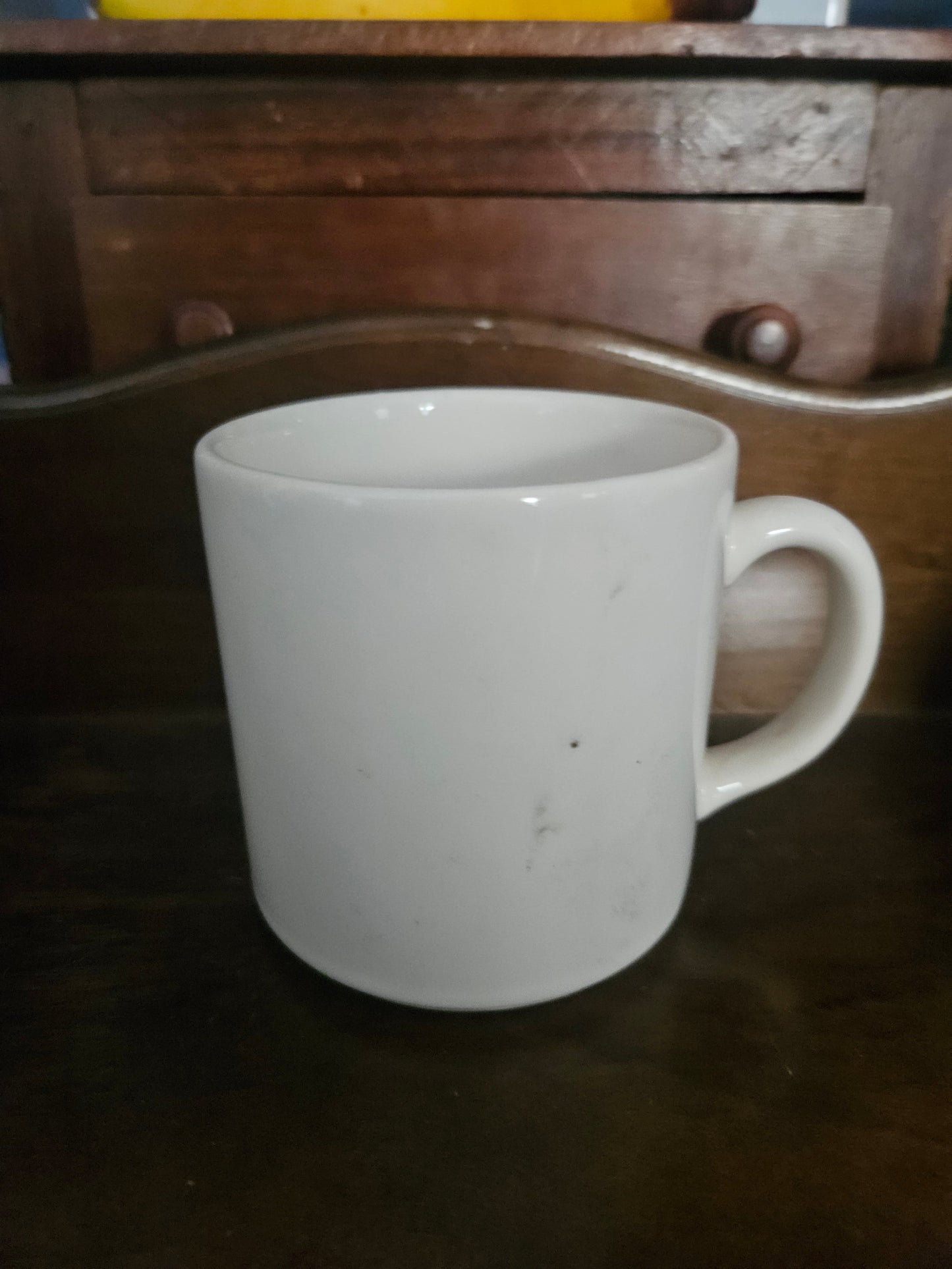 Back of lefties do it right mug showing plain white ceramic exterior