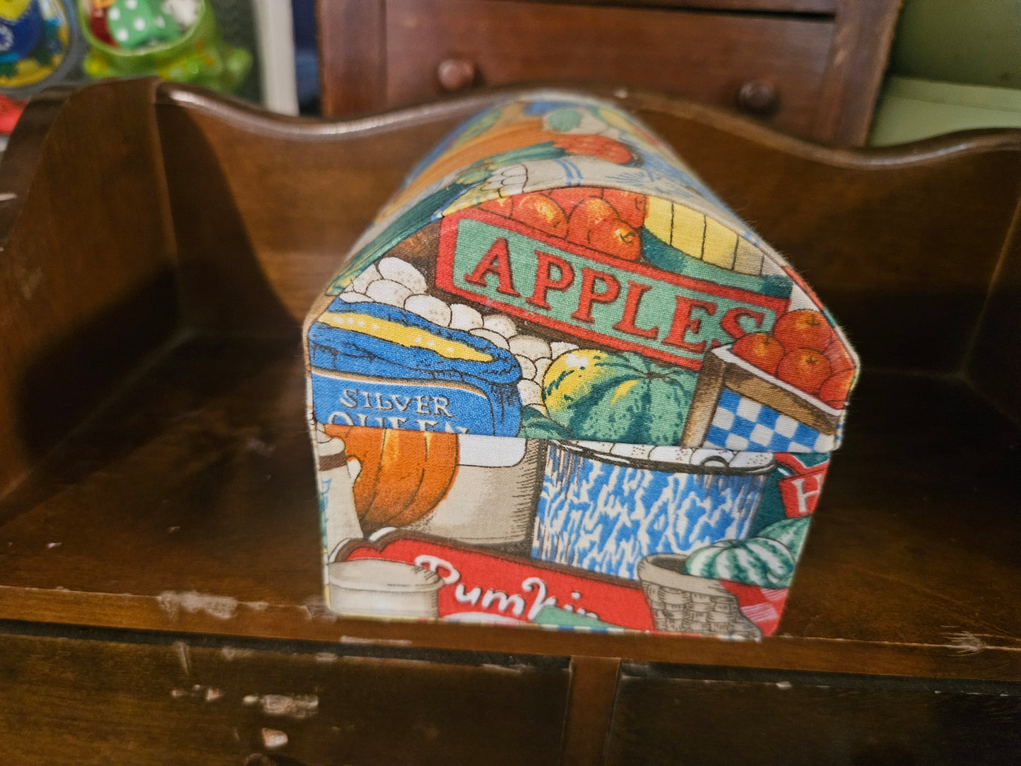 Side of recipe box showing Apples sign, Silver Queen, and pumpkin