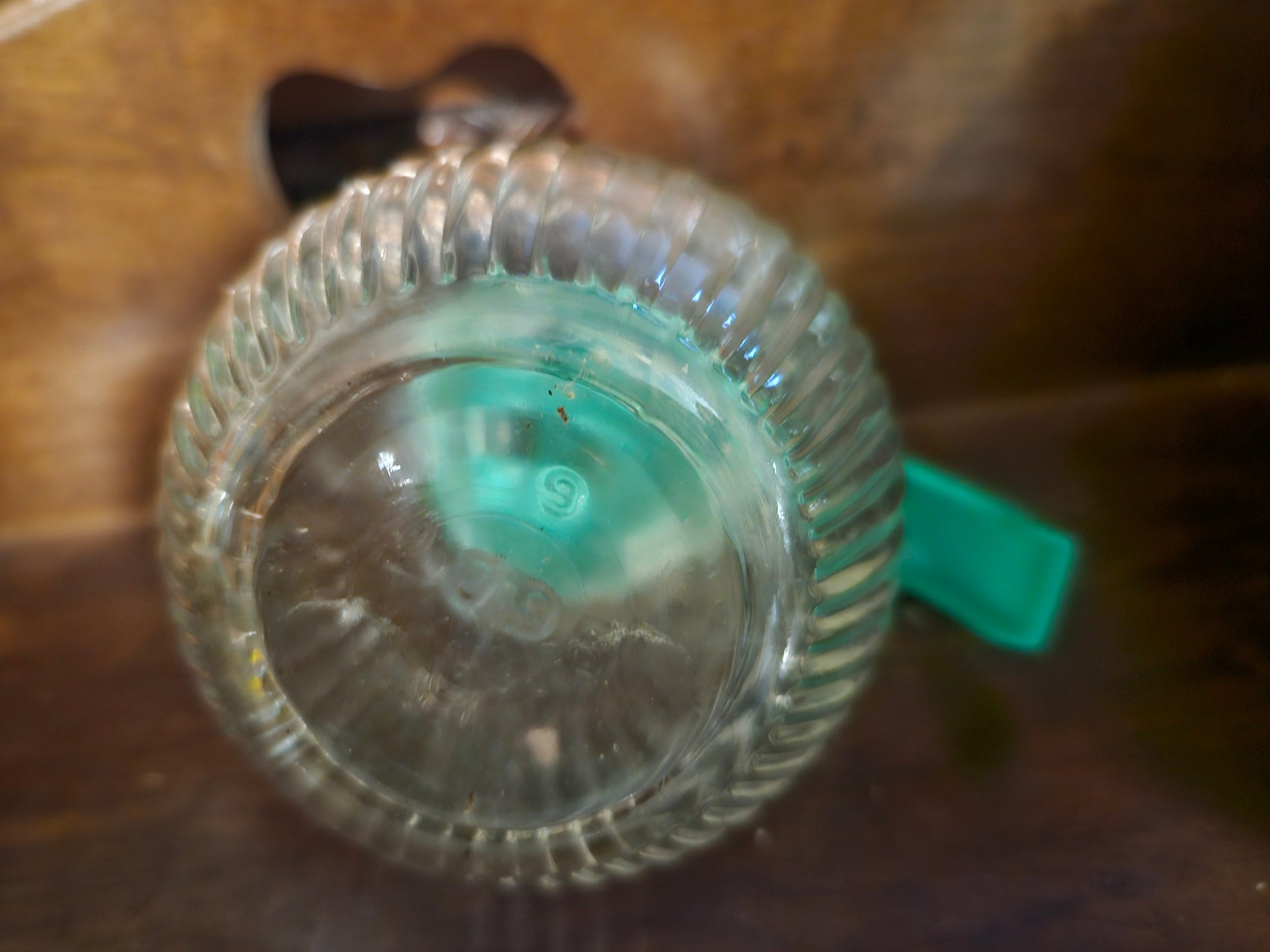 Bottom of Hazel Atlas syrup dispenser showing H over A mold mark and S identifier