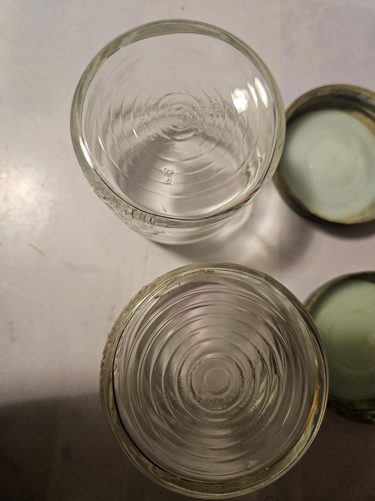 Pair of clear Ball jars with aged zinc lids, front view