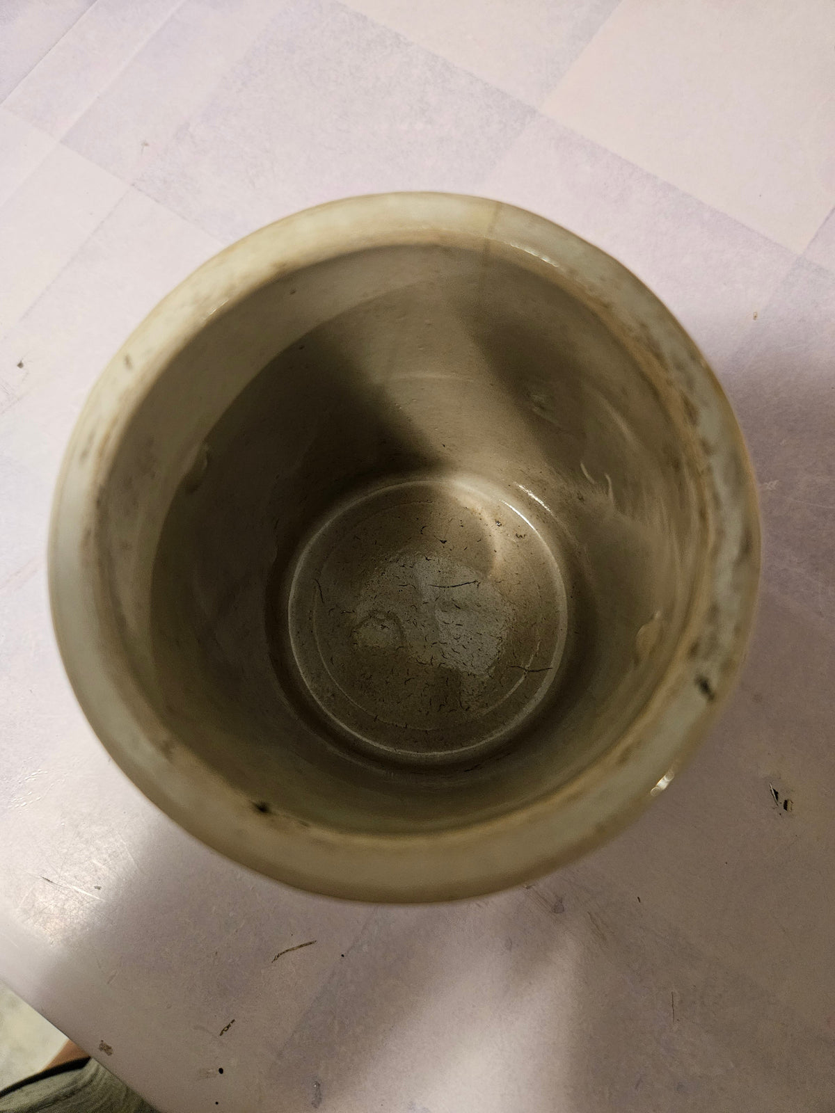 Inside of Kaukauna Klub ceramic crock showing wear