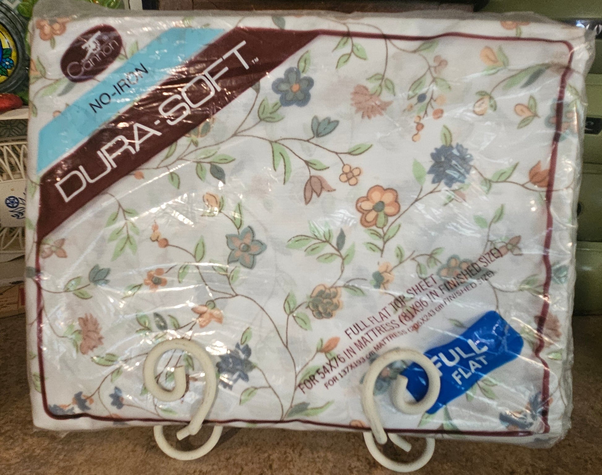 Cannon Dura-Soft No-Iron Full Flat Sheet in original sealed packaging showing floral print and label