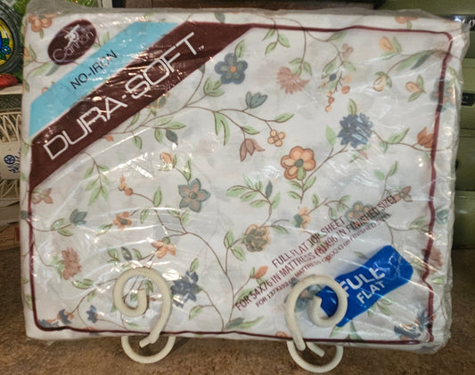 Cannon Dura-Soft No-Iron Full Flat Sheet in original sealed packaging showing floral print and label