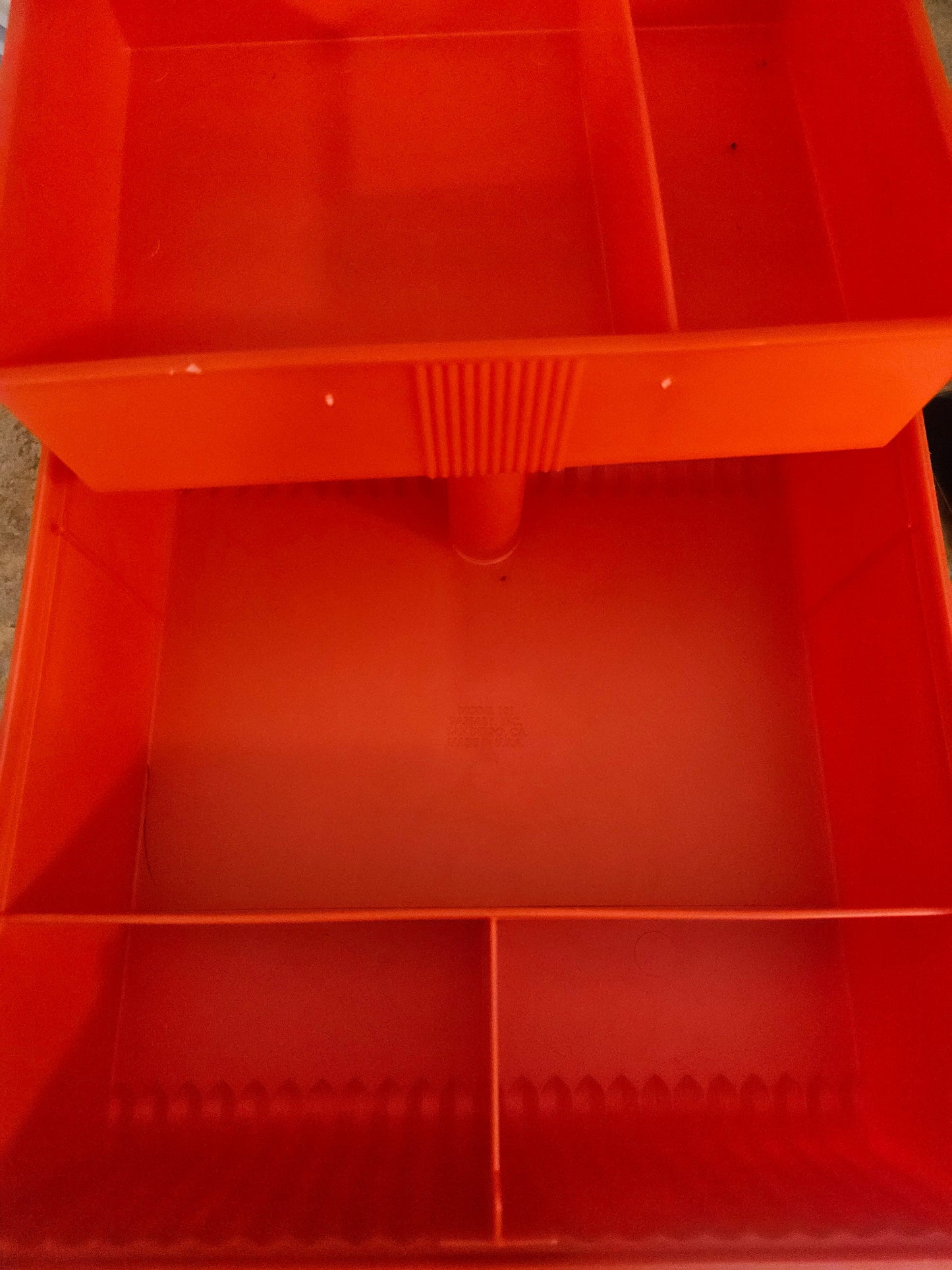 Interior of Sassaby case showing two-tier divided compartments and lower well