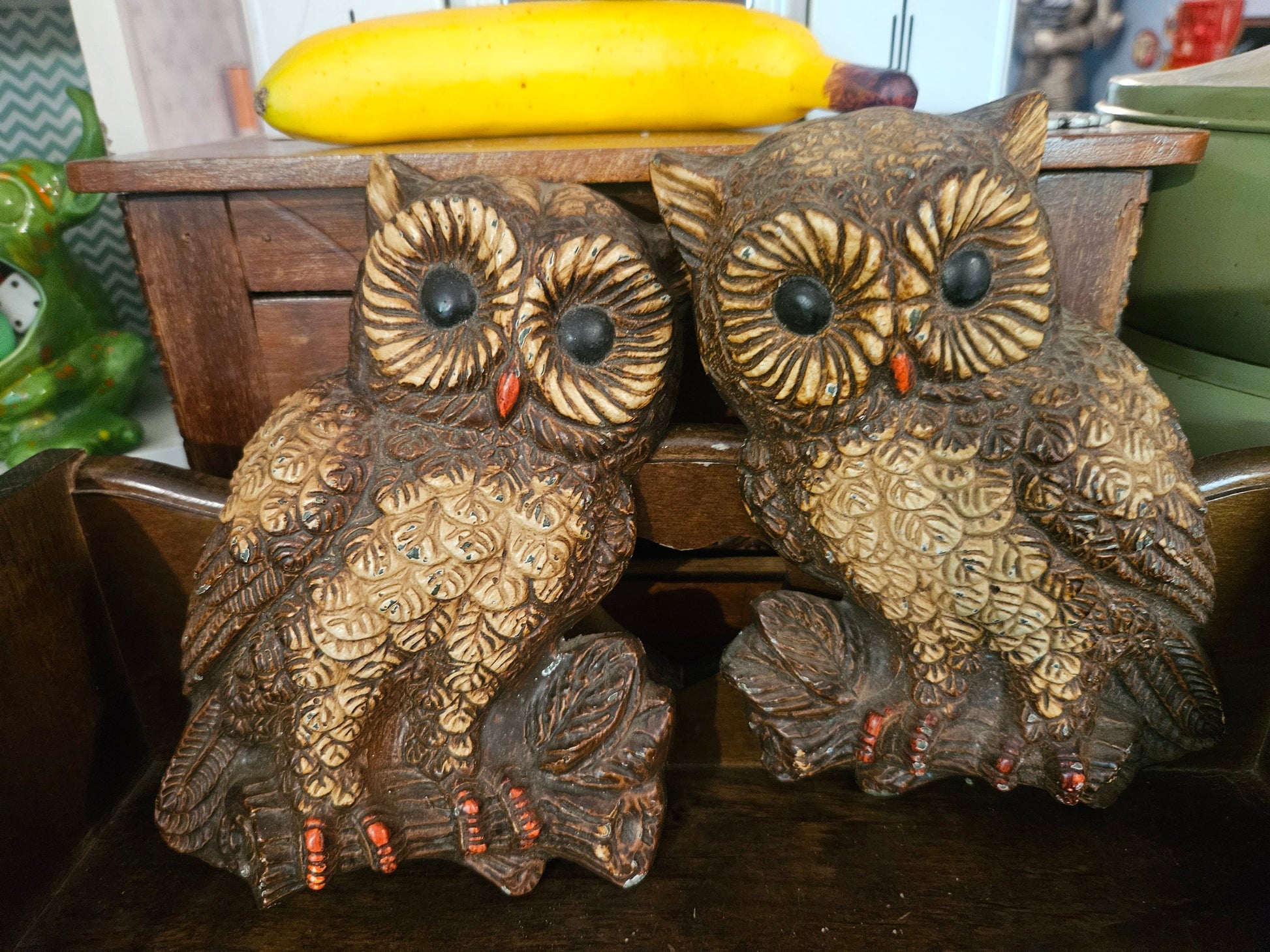 Pair of vintage 1970s chalkware owl wall hangings front view showing textured brown feathers and black dome eyes