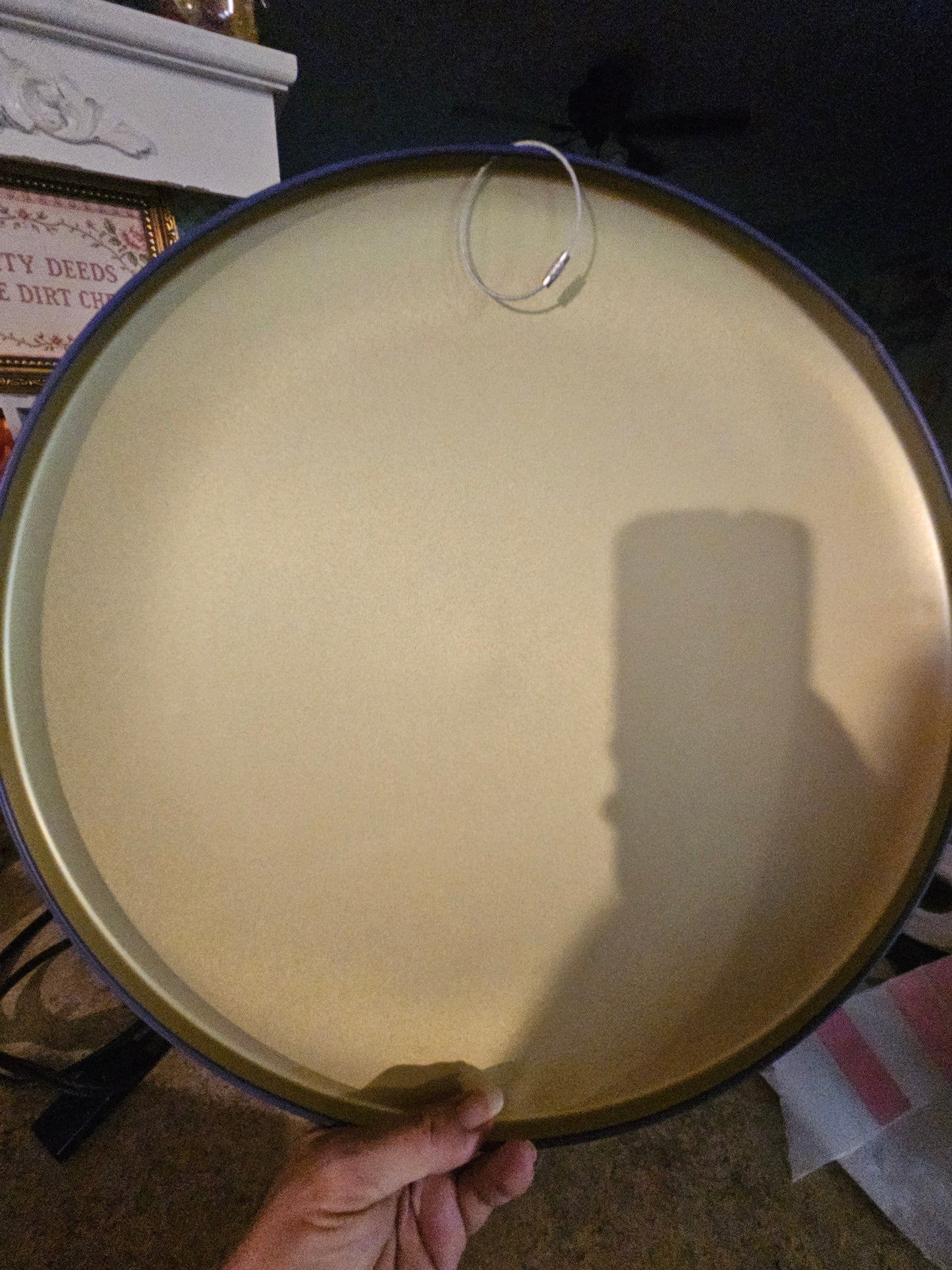 Back of Moon Pie round metal sign showing wire hanger loop and gold metal back